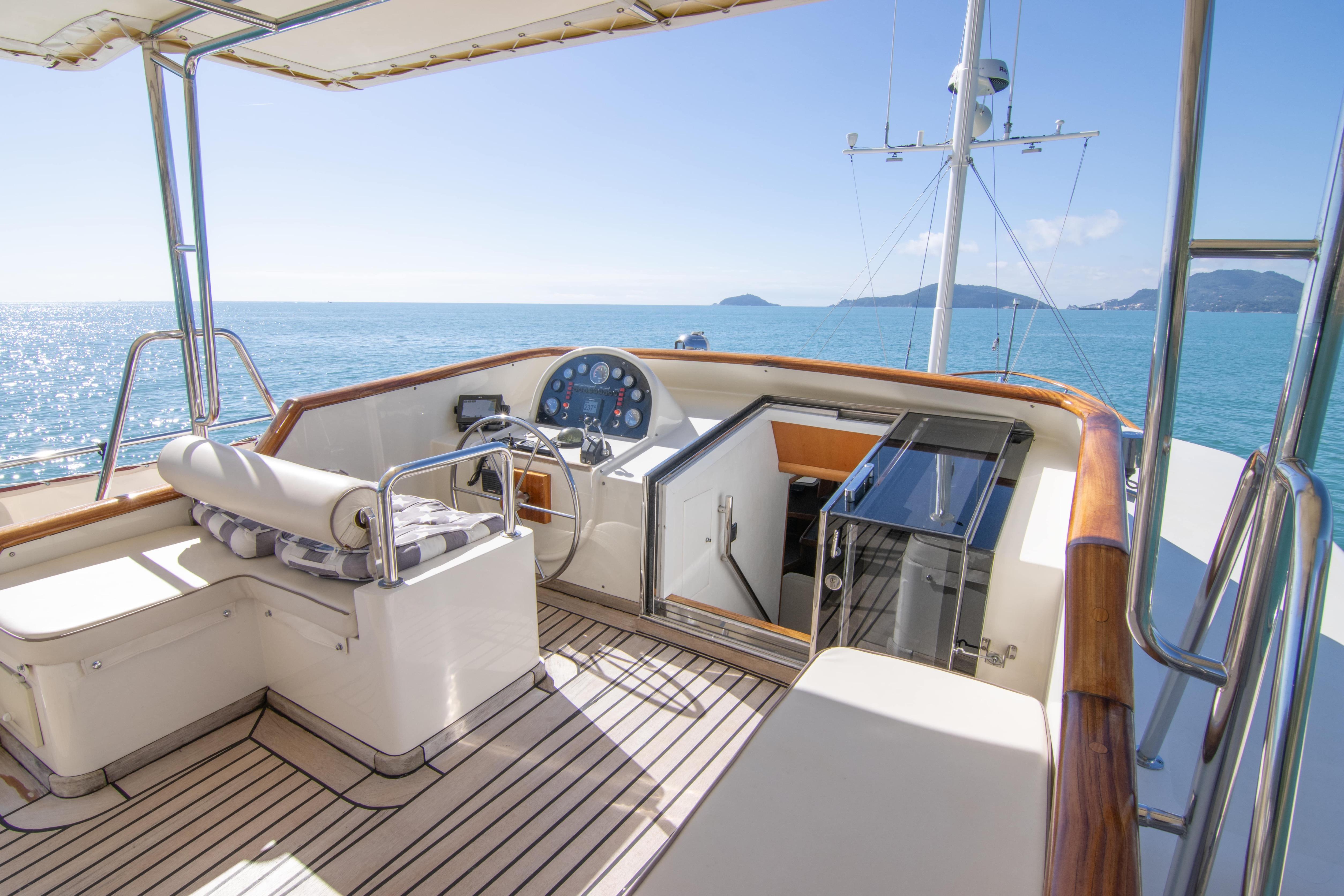 Luxurious Bugari NAVETTA 2000 yacht deck with ocean view and elegant seating area.