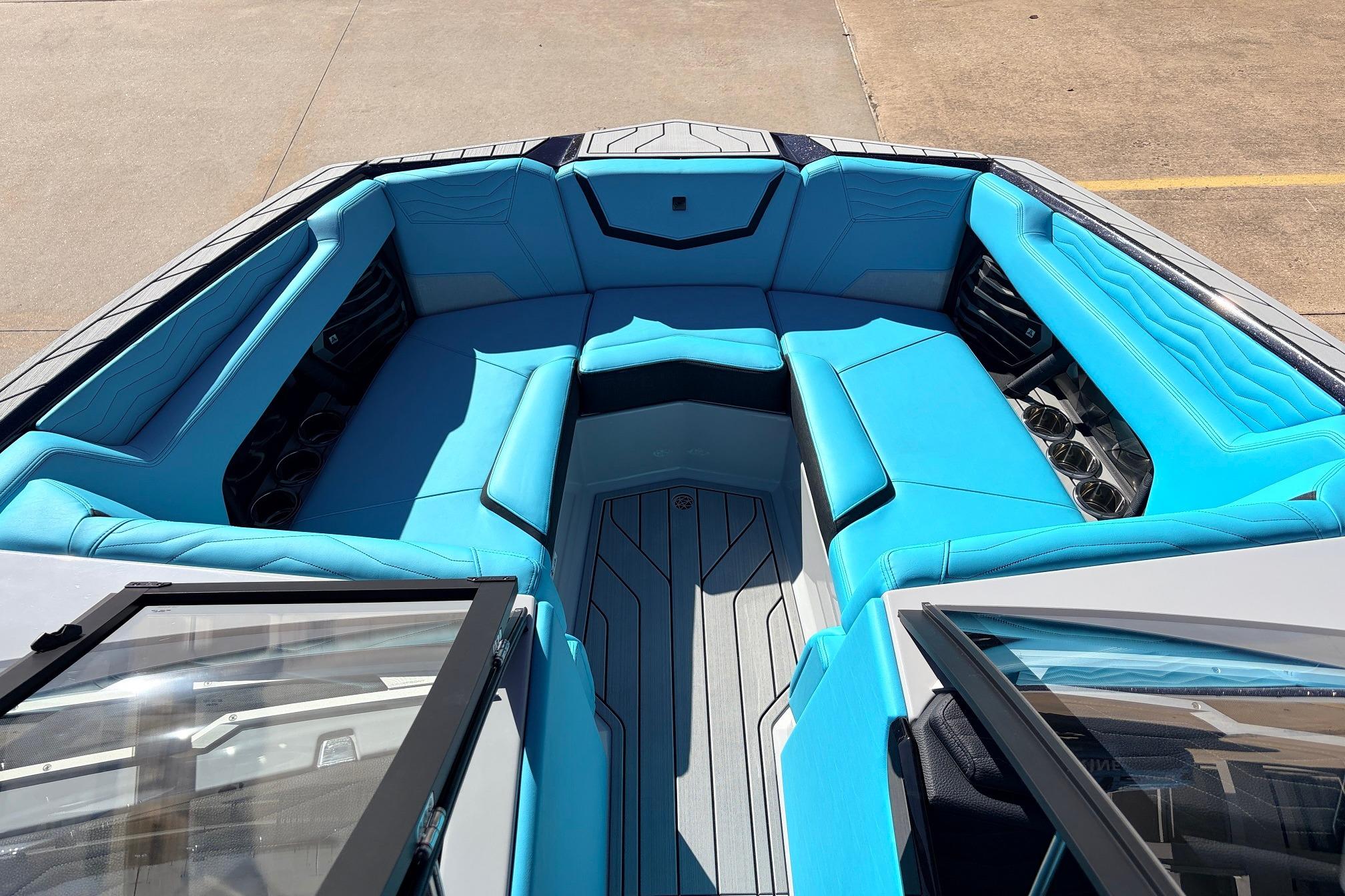 2026 Nautique Super Air Nautique G23 boat interior with vibrant blue seating and sleek design.