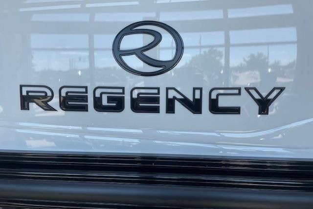 Regency 230 DL 2026 logo on vehicle exterior, showcasing sleek design and branding.