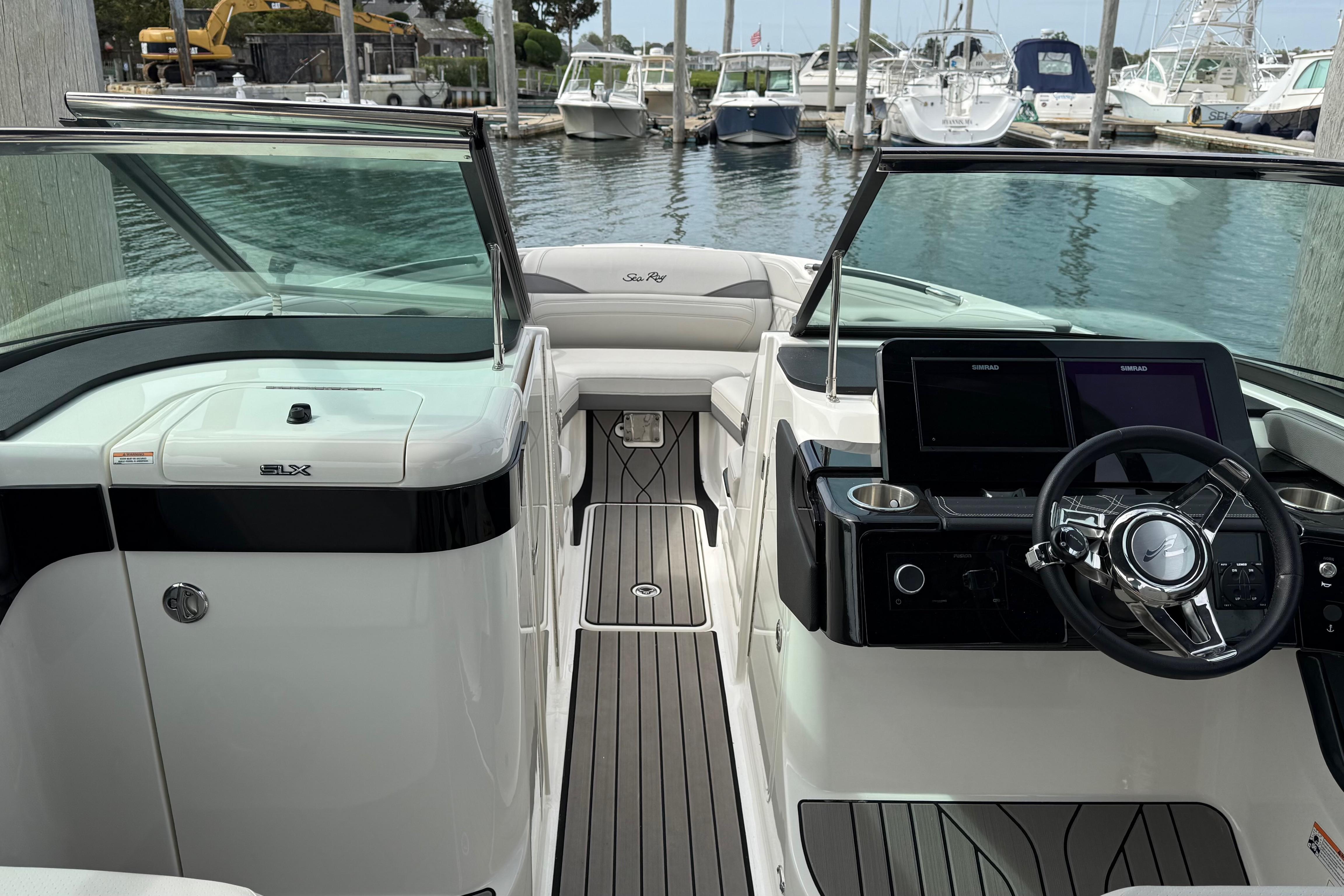 Interior view of 2023 Sea Ray SLX 260 Outboard at dock.