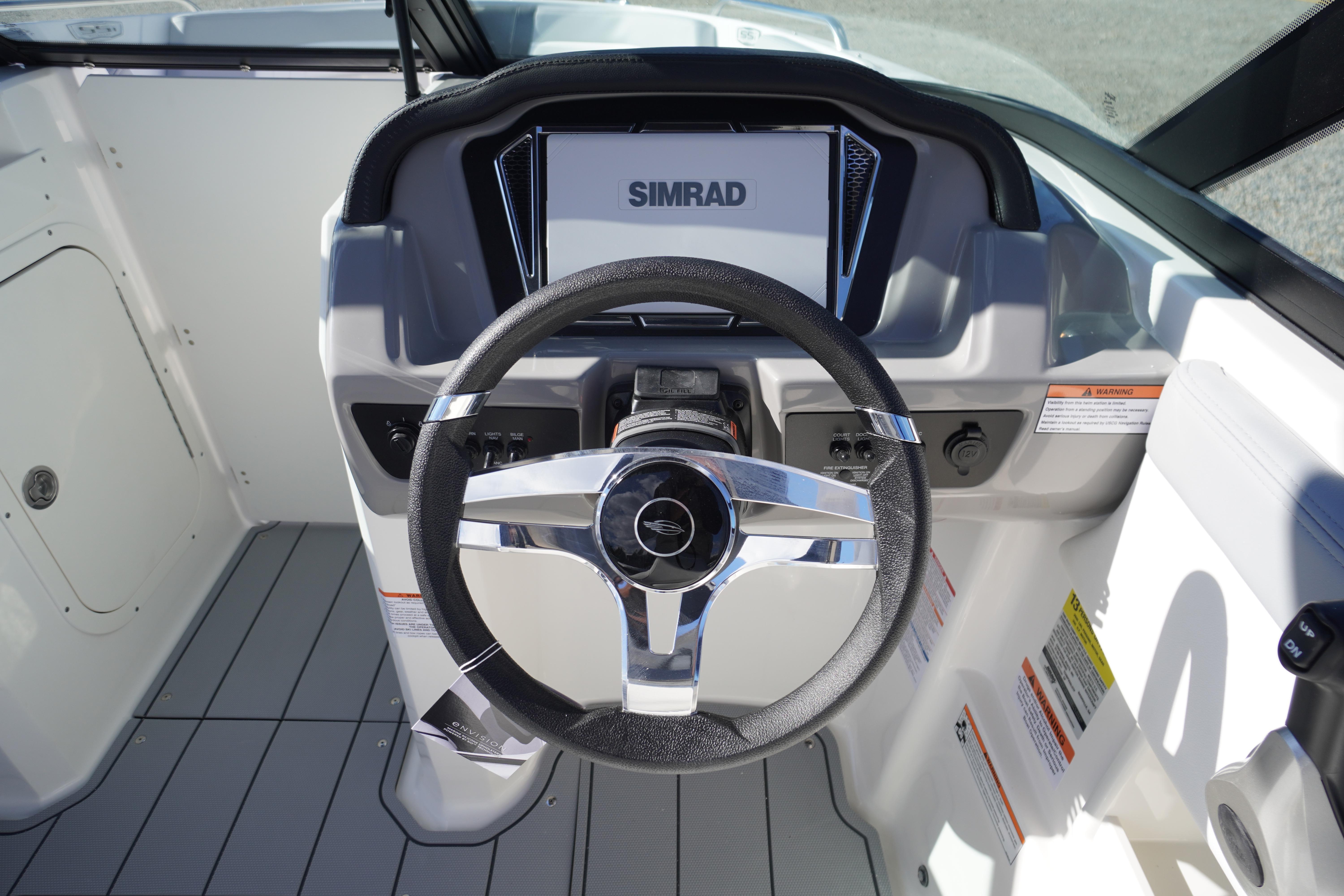 Steering console of 2026 Chaparral 23 SSi OB boat with Simrad display.