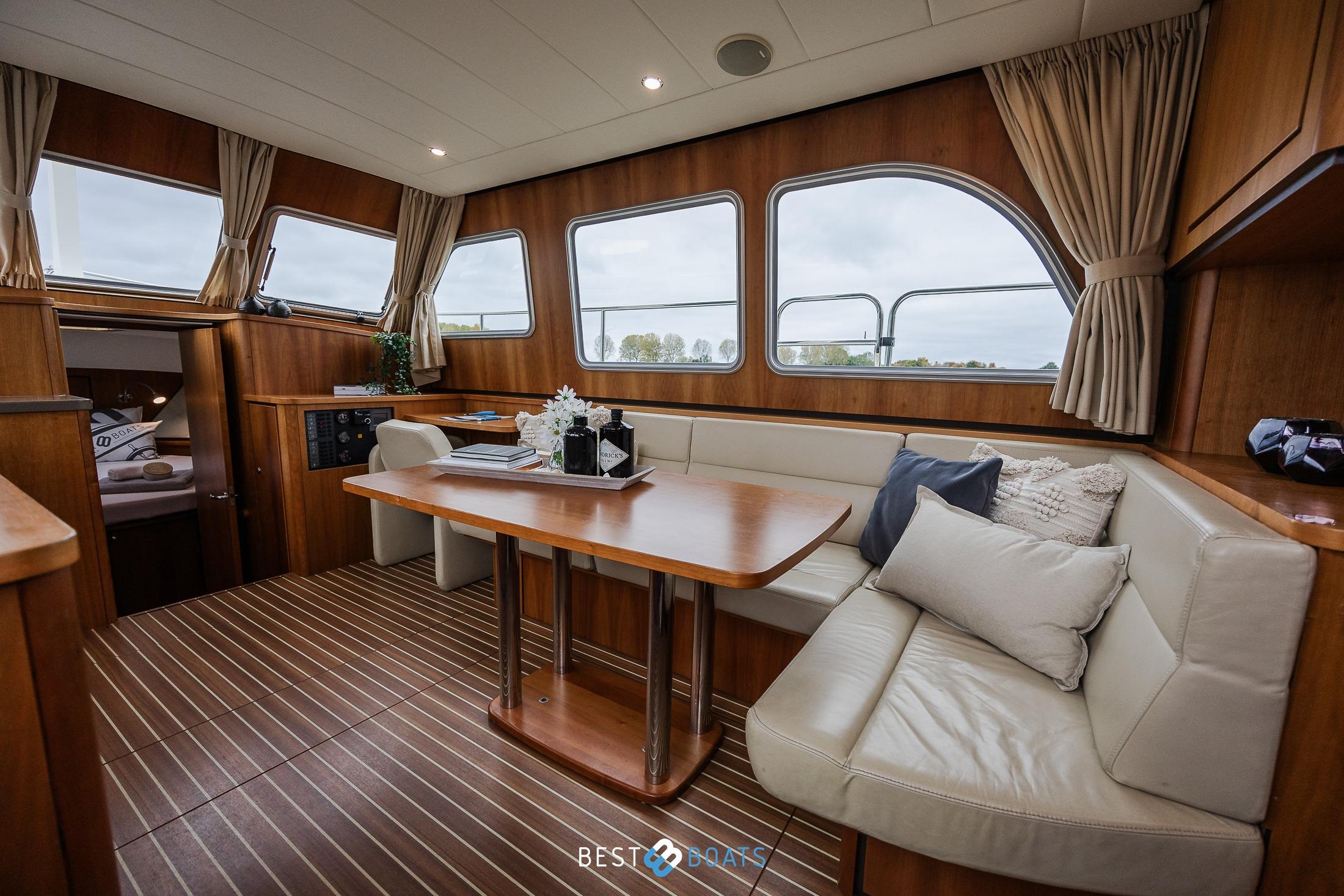 Luxurious interior of 2014 Linssen Grand Sturdy 34.9 AC yacht with elegant wood finish.