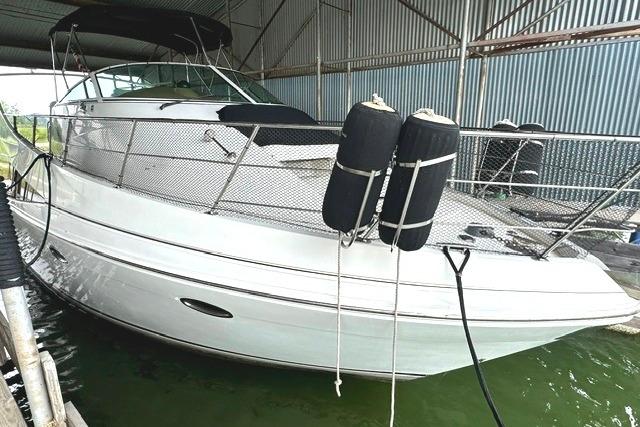 2004 Carver 360 Mariner yacht docked in a covered marina.