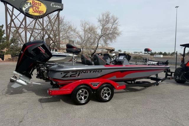 2026 Nitro Z21 XL boat with red accents parked near Bass Pro Shops.