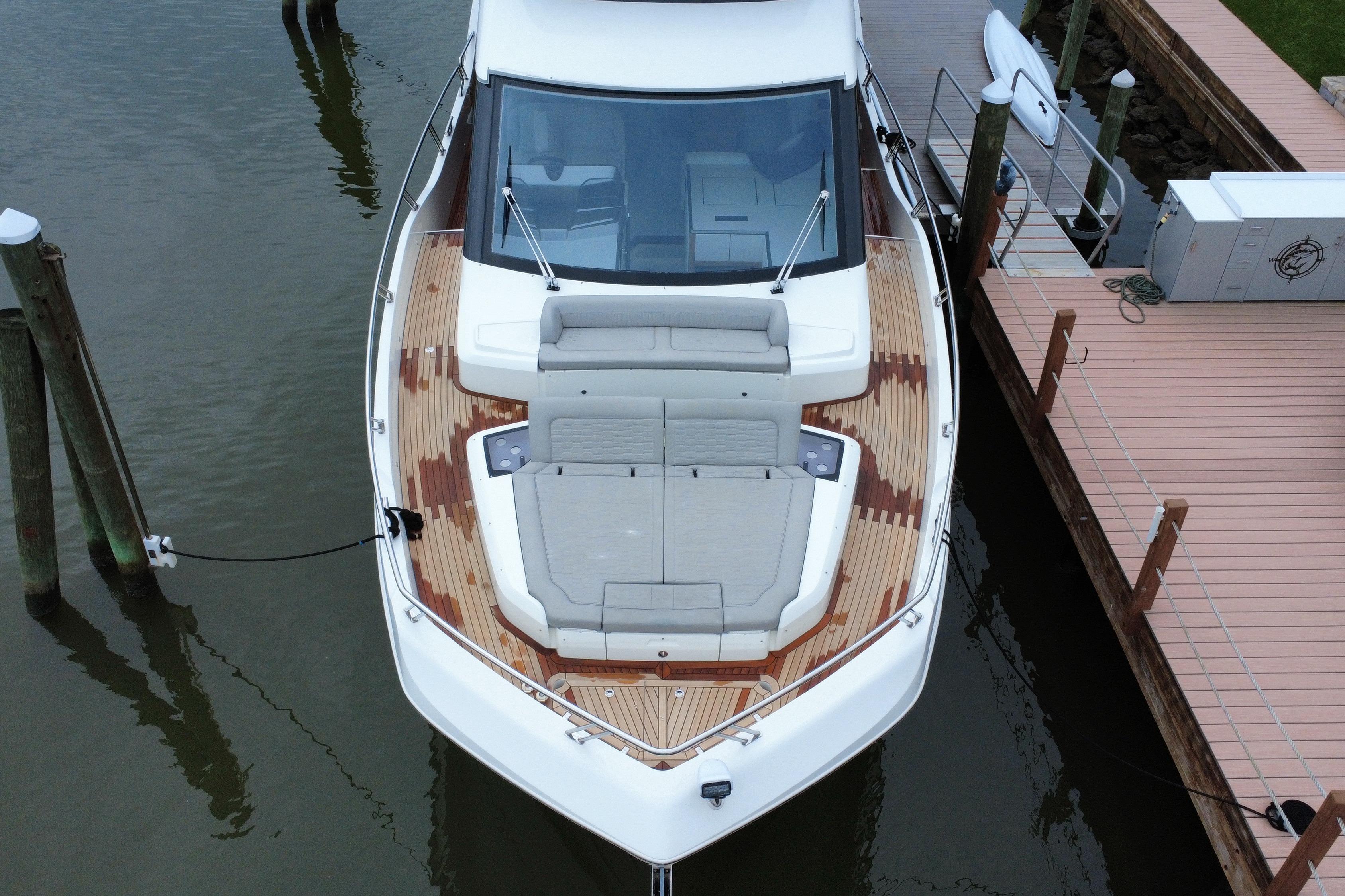 2024 Galeon 560 Fly yacht docked, showcasing sleek design and spacious deck.