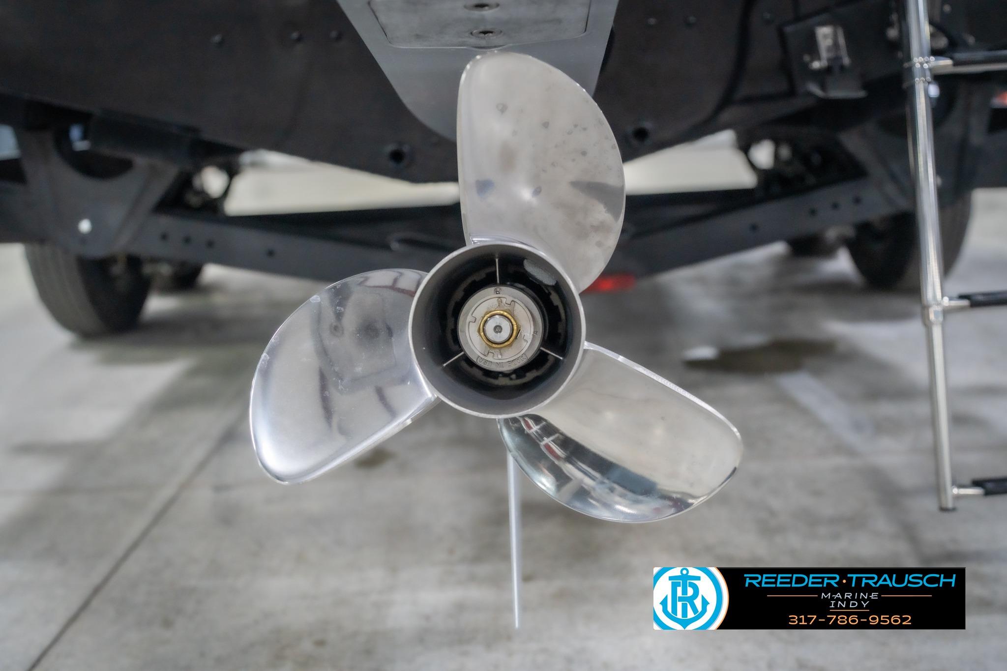 Propeller of 2026 Lund 2075 Impact XS boat, displayed indoors.