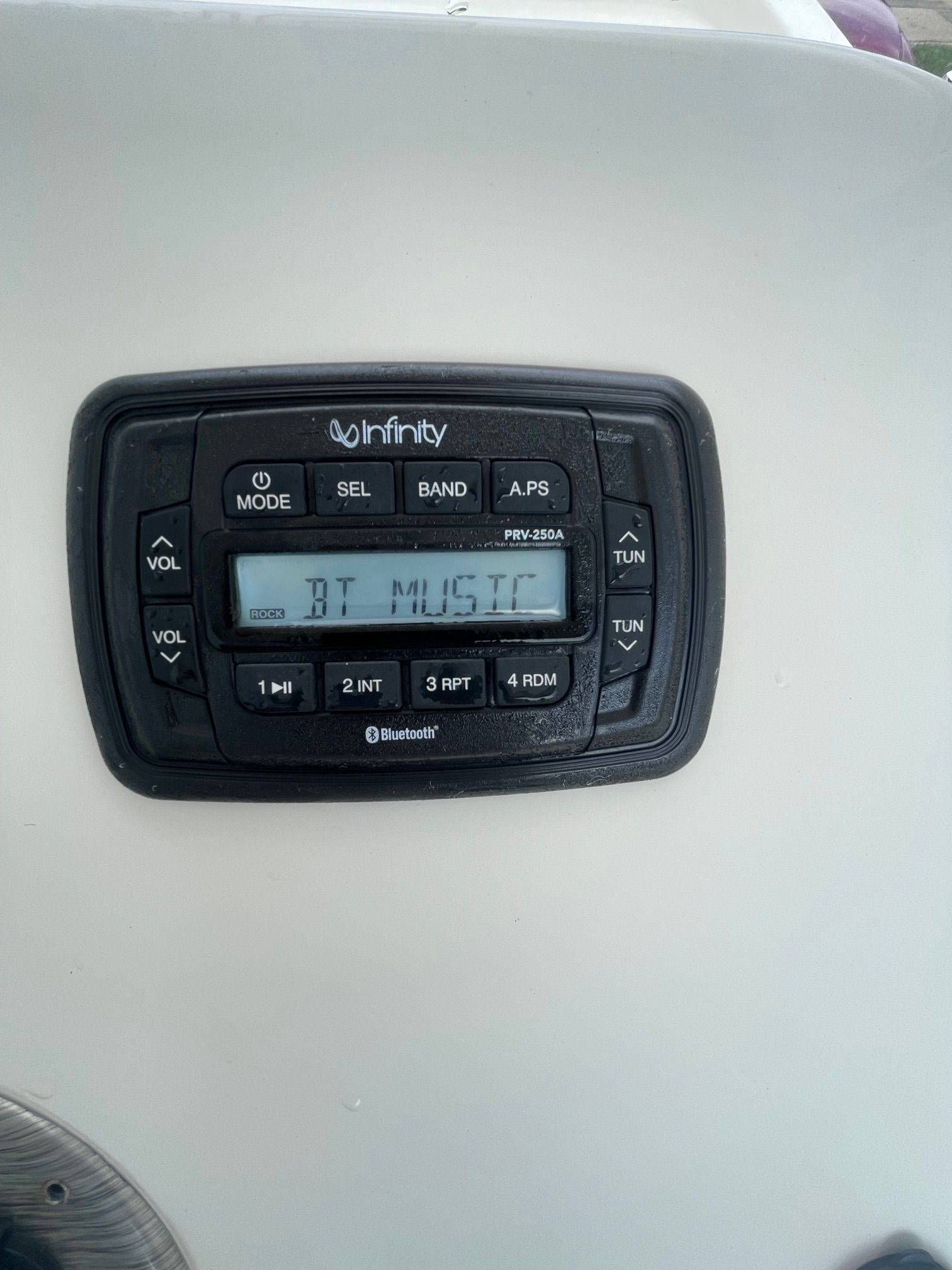 An Infinity boat stereo panel with Bluetooth functionality on a 2020 Carolina Skiff 23LS.