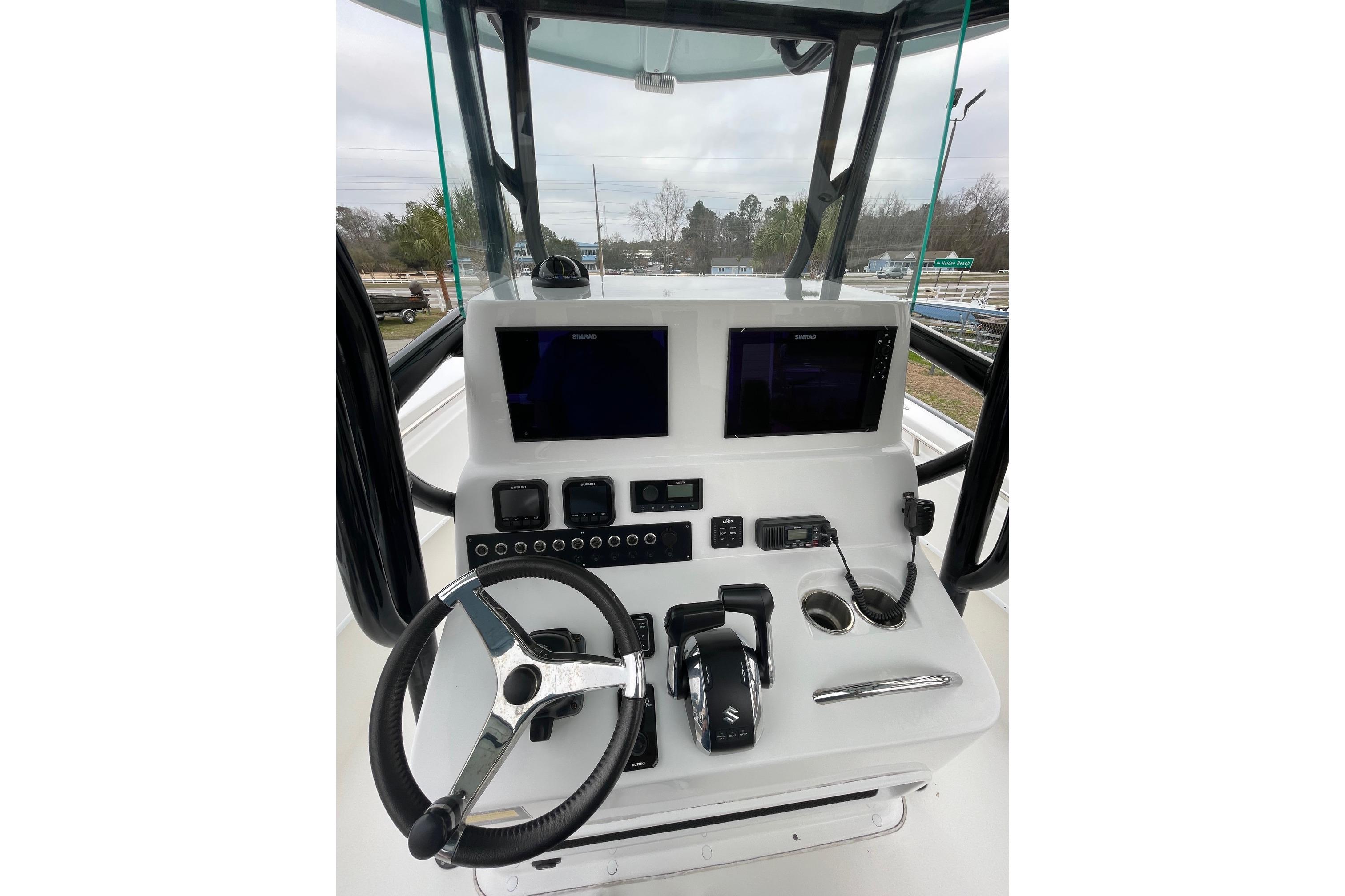 2023 Cape Horn 24 XS boat console with steering wheel and electronic controls.