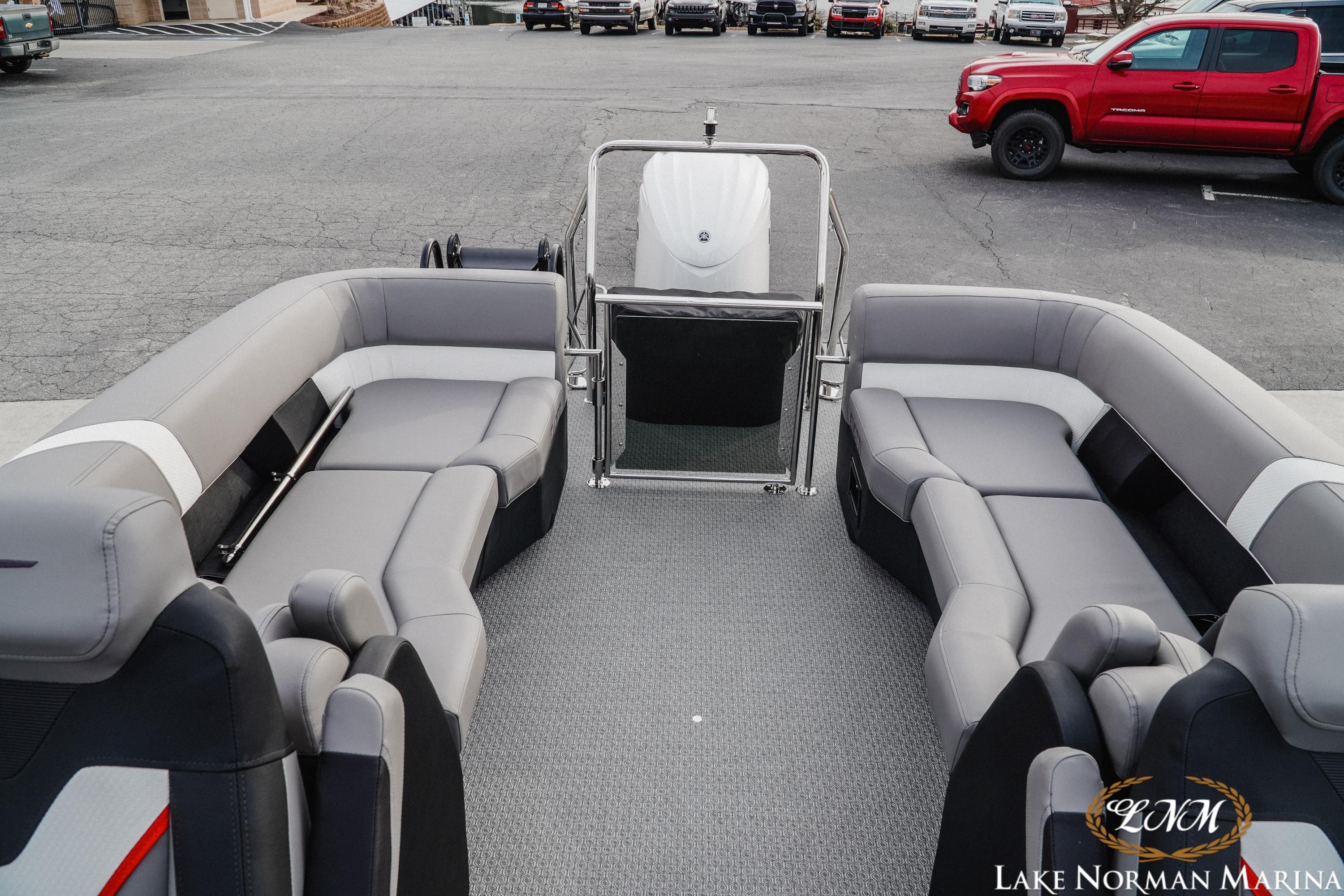 Interior of 2026 Evotti 723QL boat with gray seating at Lake Norman Marina.