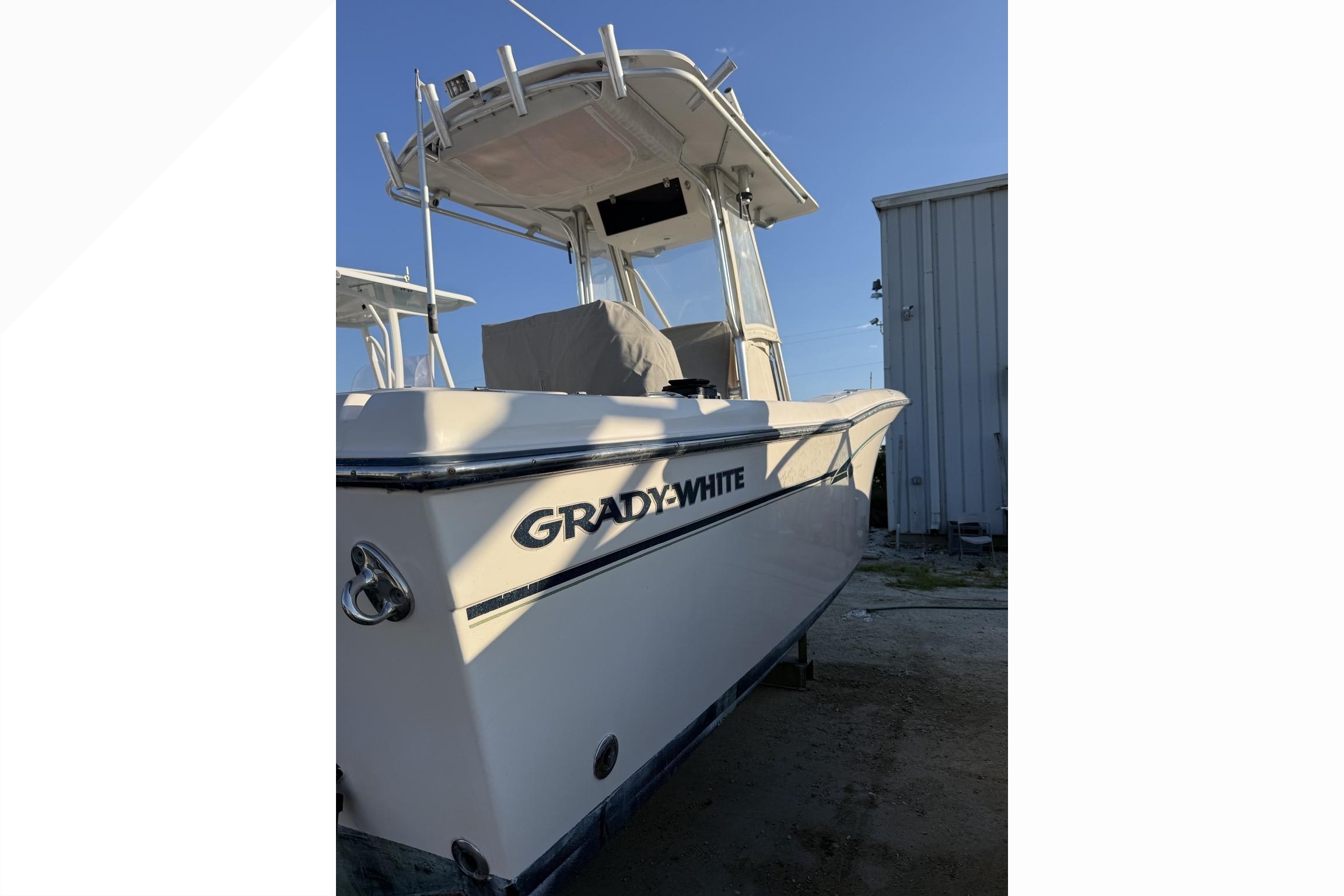 2011 Grady-White Fisherman 230 boat docked, showcasing sleek design and sturdy build.