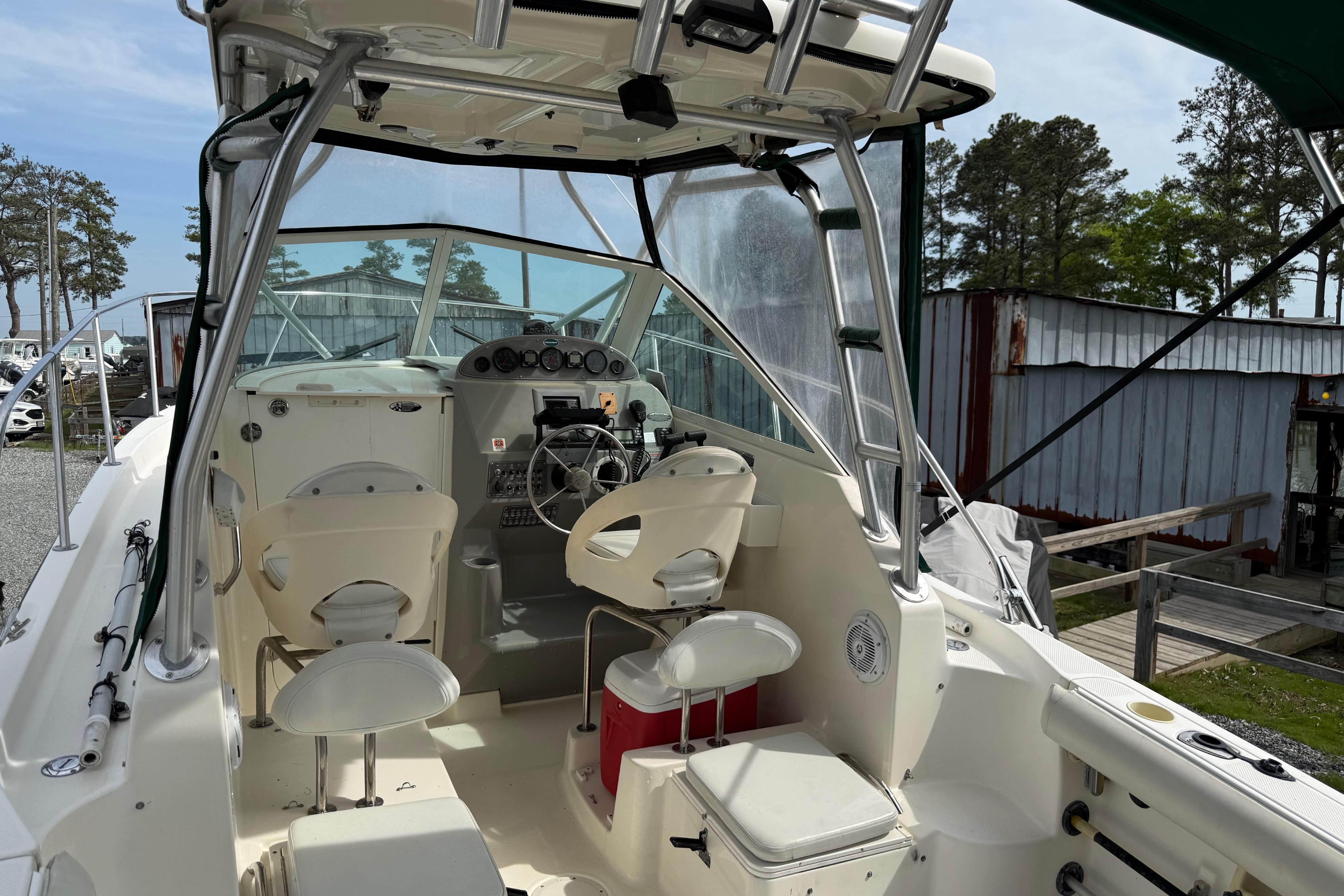 2006 Trophy 2502 Walkaround boat interior with steering wheel and seating.