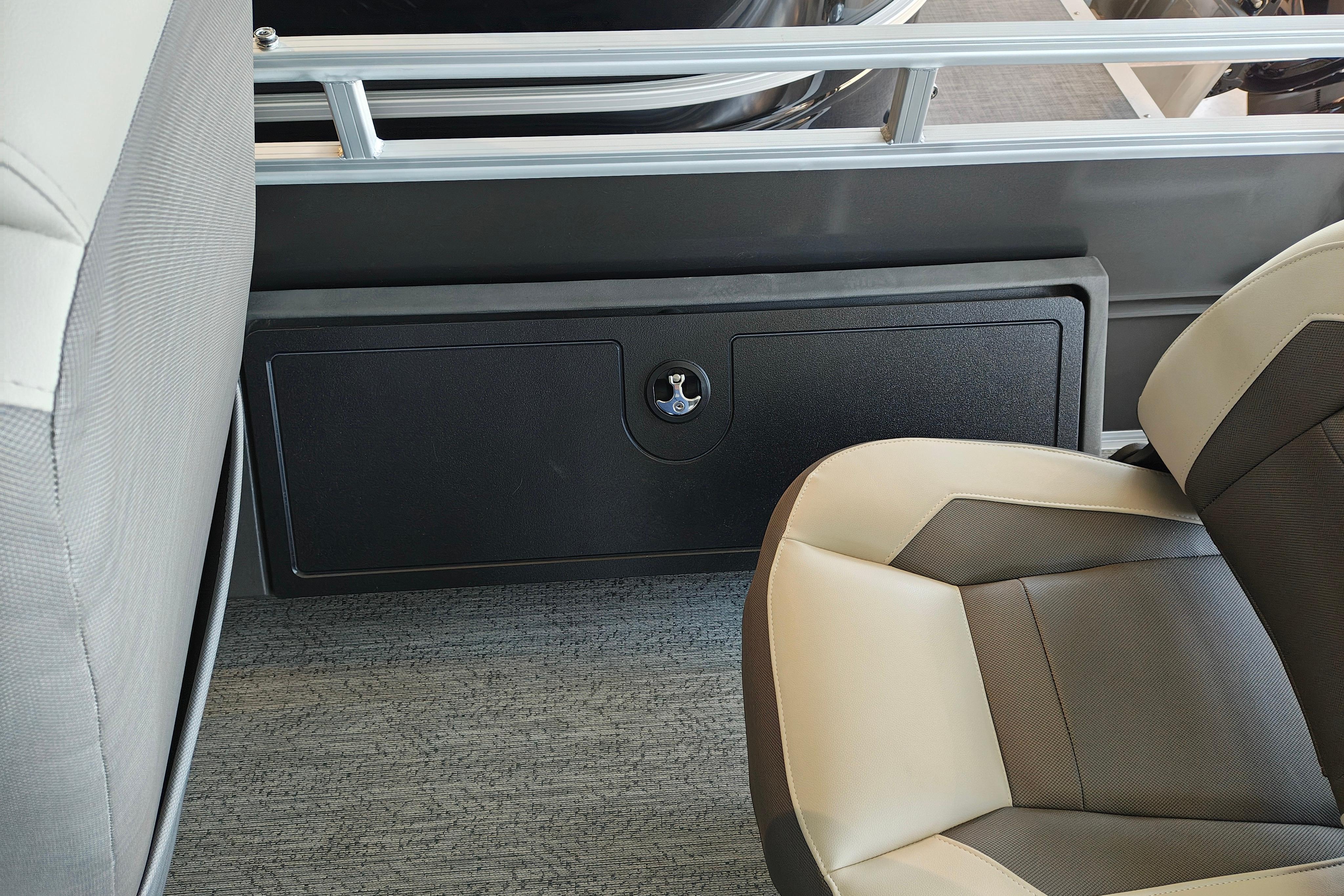 2026 Sun Tracker Fishin' Barge 22 XP3 interior seating and storage compartment.