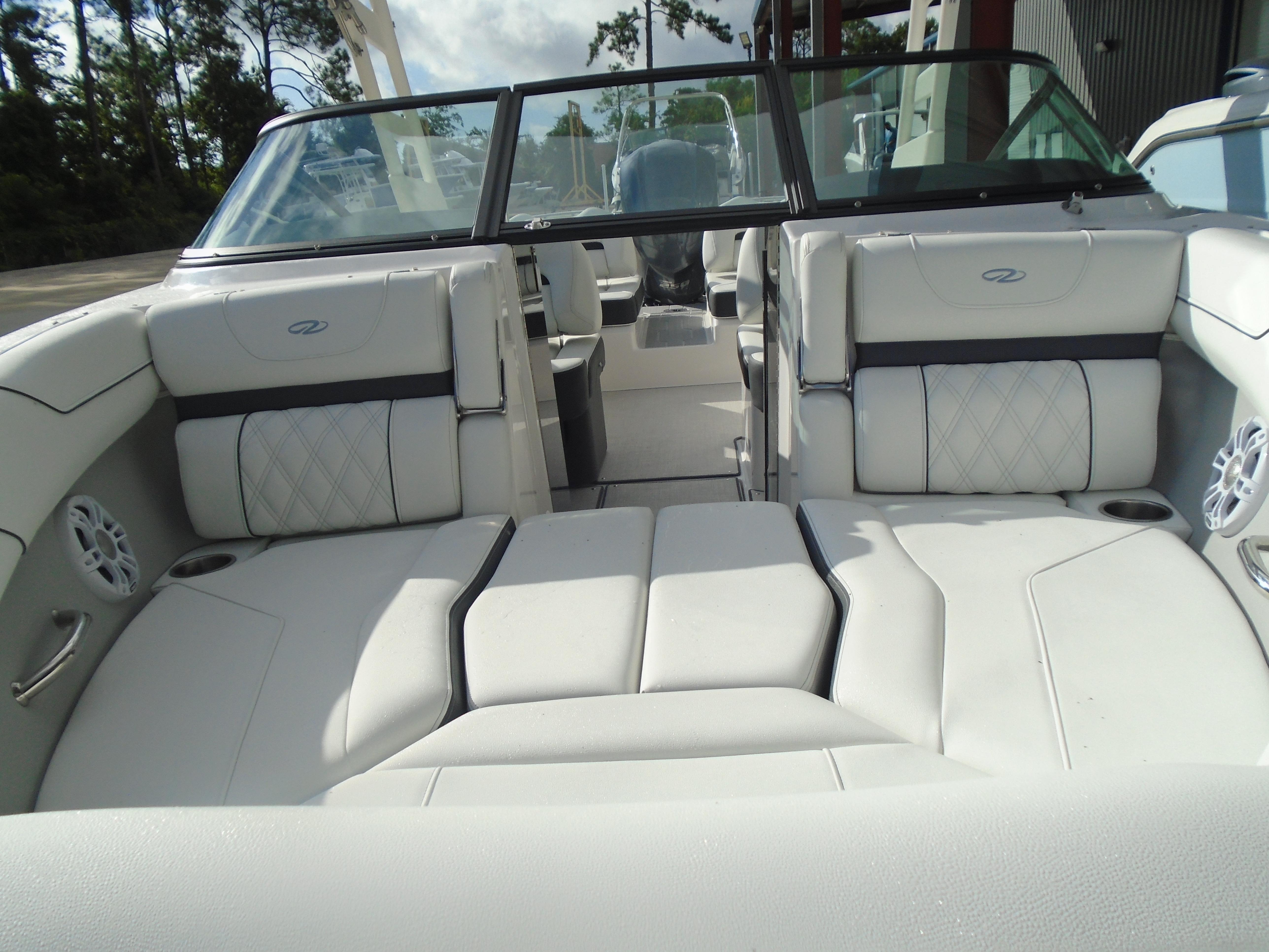 2025 Regal LX2 boat interior with white leather seating and modern design.