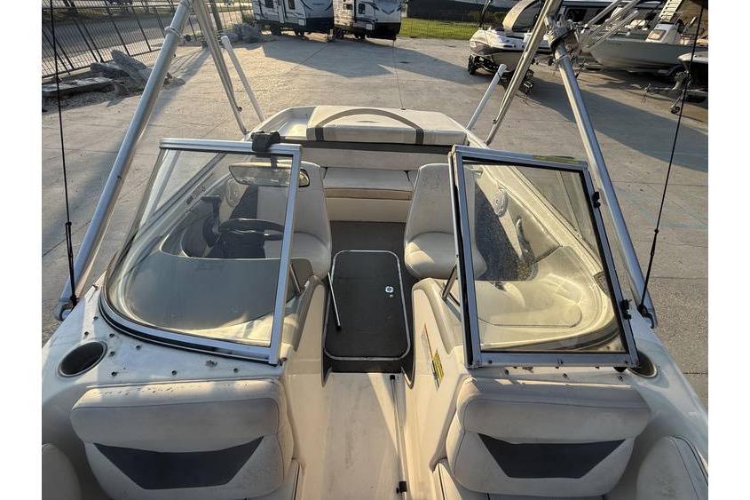 2008 Bayliner 185 Bowrider interior with open windshield and seating area.