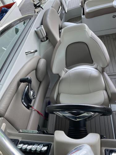 2019 Crownline E255 boat interior with steering wheel and seating.