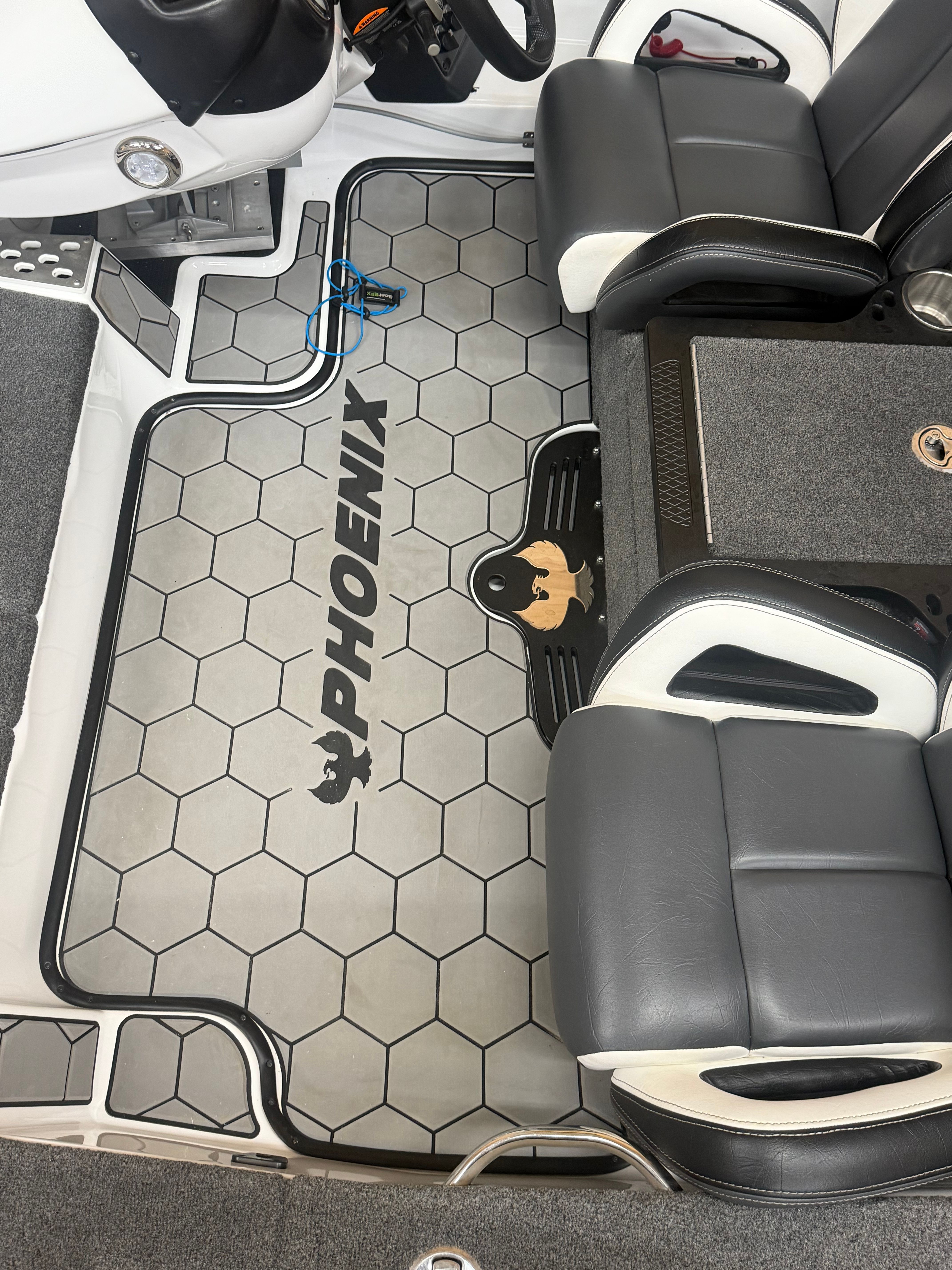 Interior of the Phoenix 920 Elite with gray and black seats and a stylish floor design.