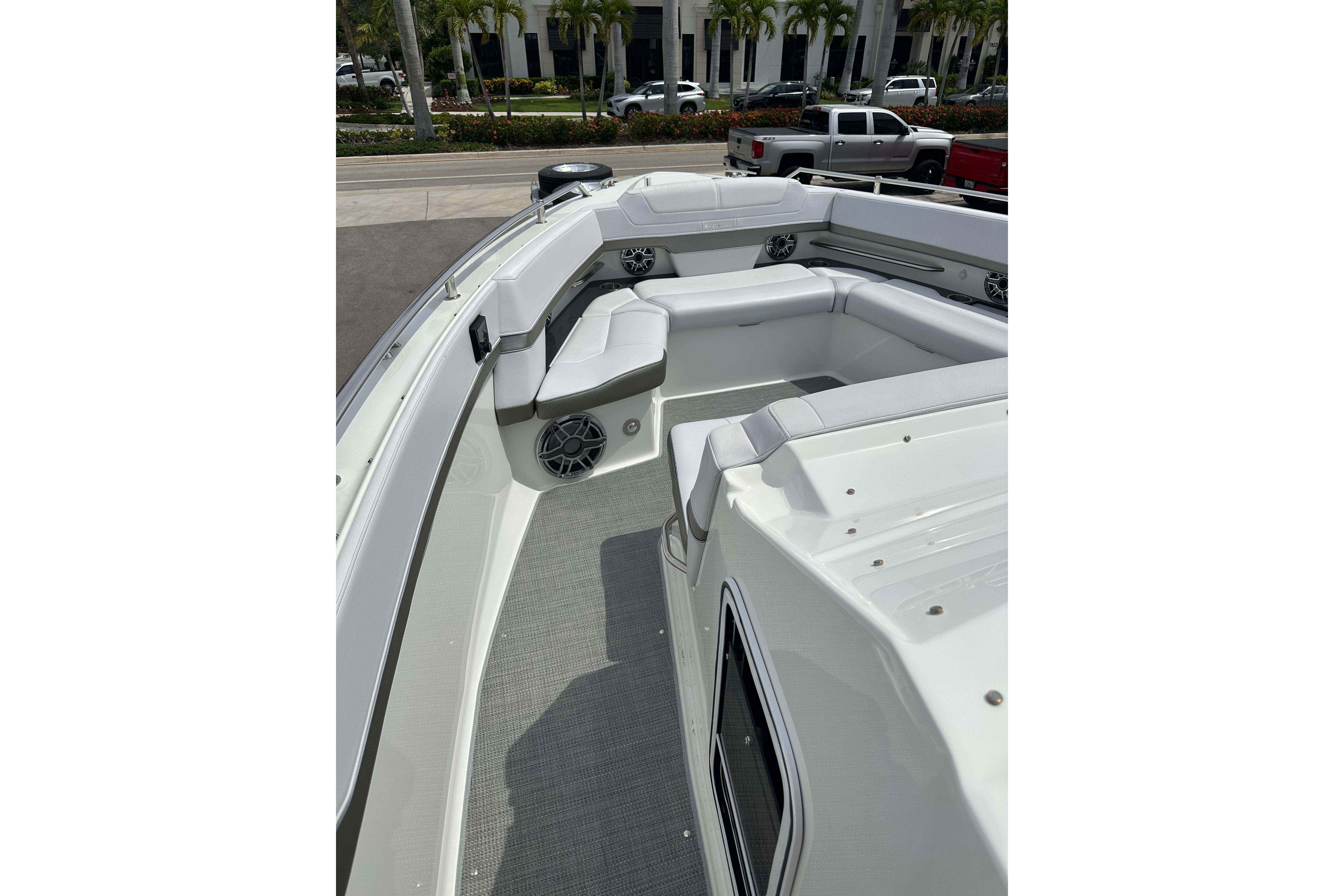 2021 Formula 380 Super Sport Crossover OB boat with spacious seating and sleek design.