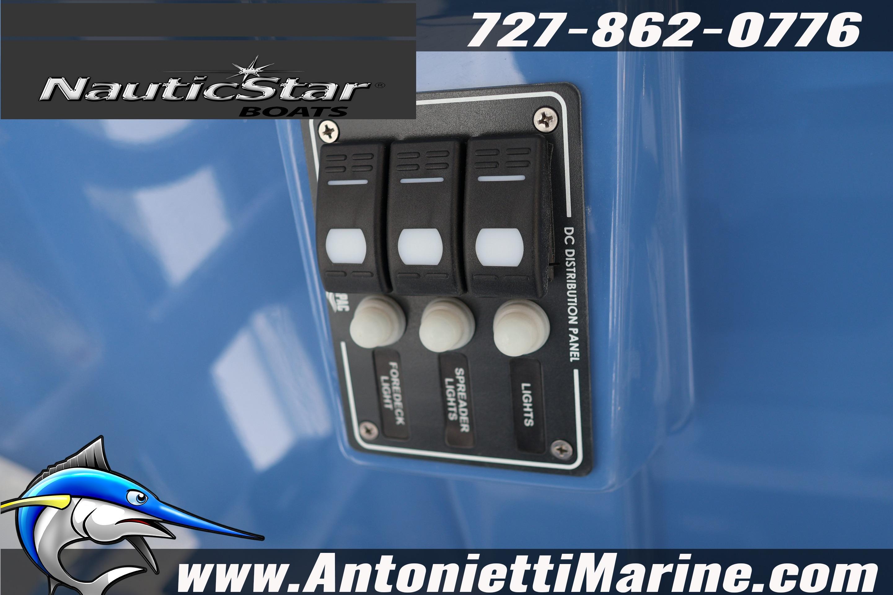 Control panel on 2026 NauticStar 292 Legacy boat, featuring switches and branding.