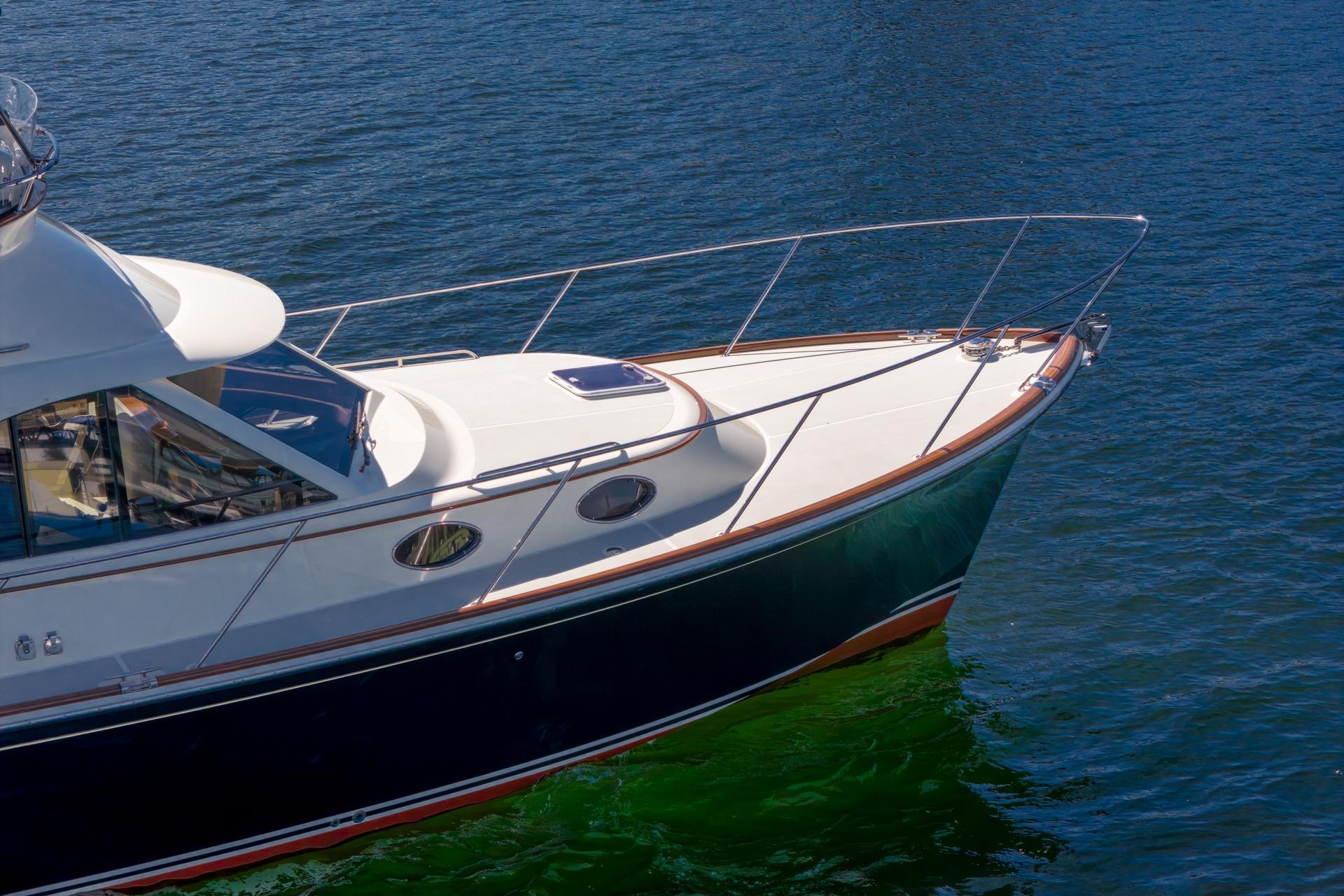 2010 San Juan SJ40FB IPS yacht on calm blue water.