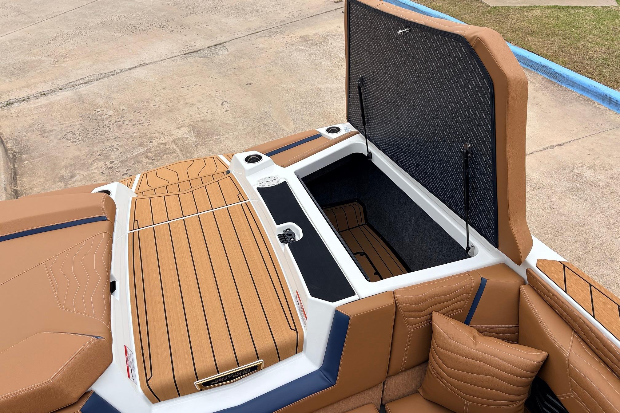 2026 Nautique Super Air Nautique G25 boat interior with open storage compartment.