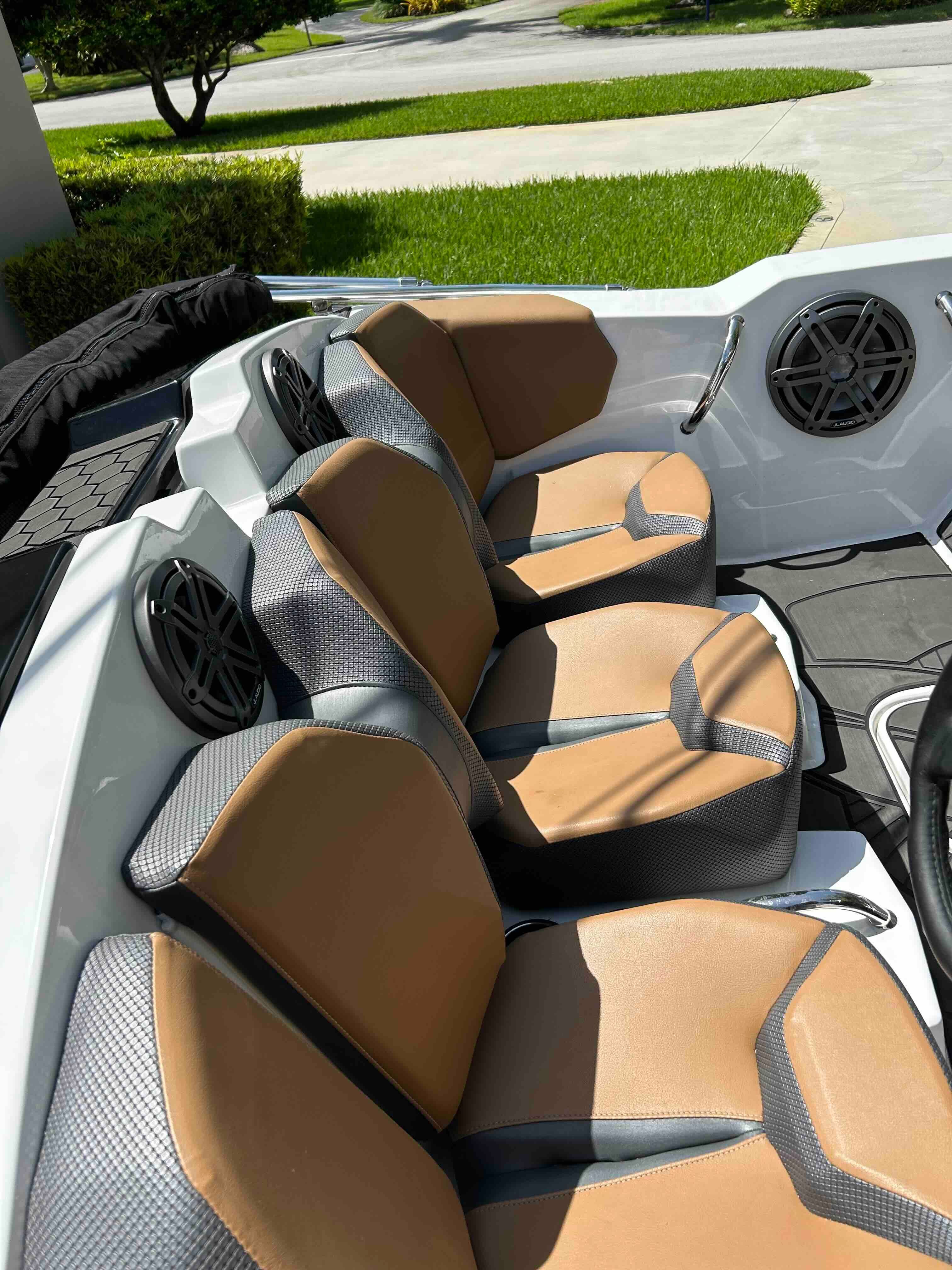 The image shows the seats of a 2022 Scarab 165 ID boat.