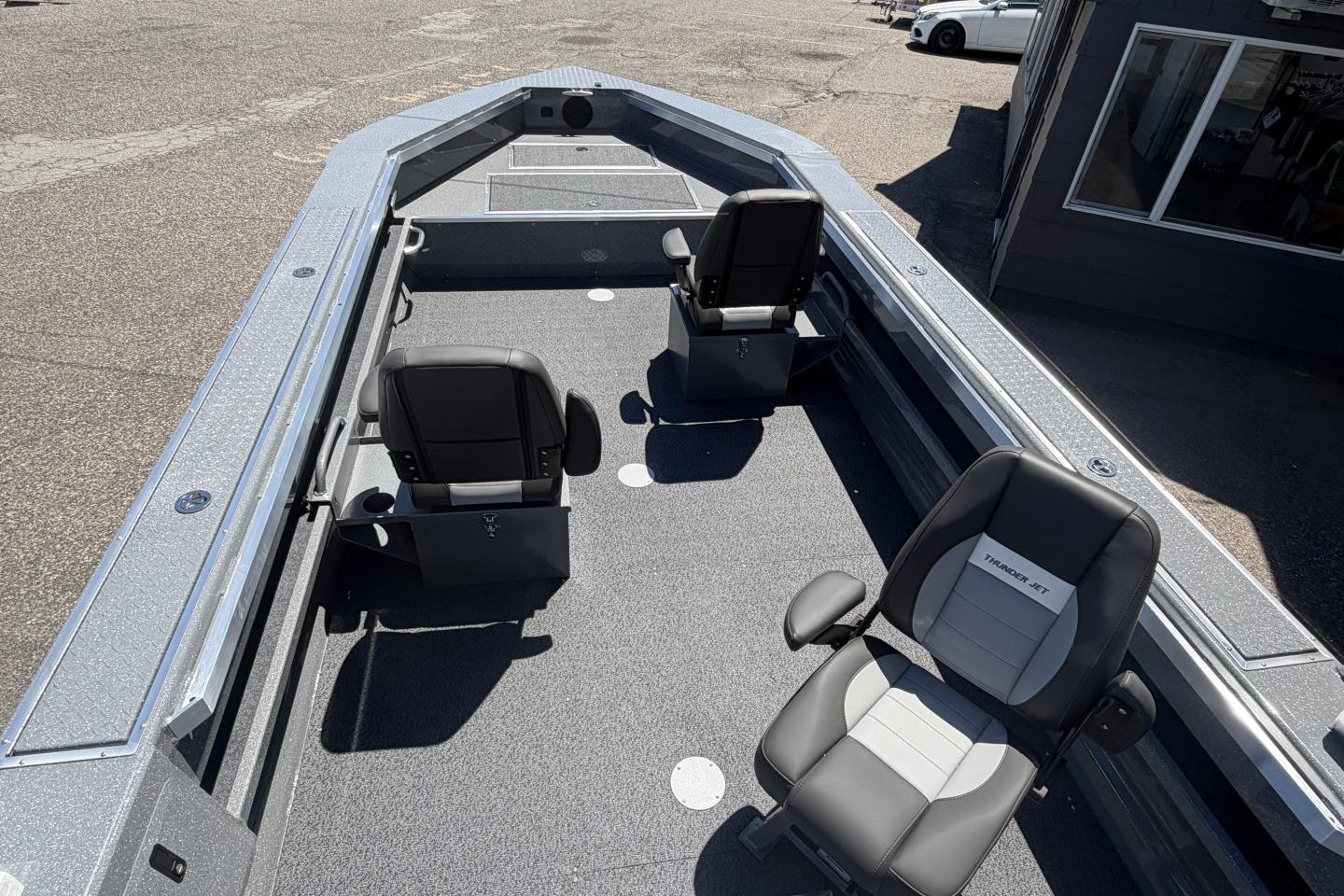 2026 Thunder Jet 209 Rush OT boat interior with two swivel seats and spacious deck.