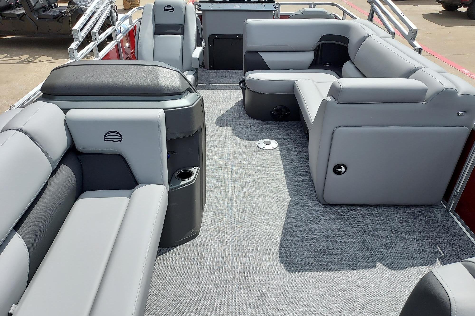 2026 Sun Tracker SportFish 20 DLX pontoon boat interior with gray seating and spacious layout.