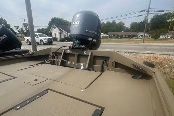 2025 G3 Gator Tough 18 CCJ boat with 80 HP engine, parked near a road.