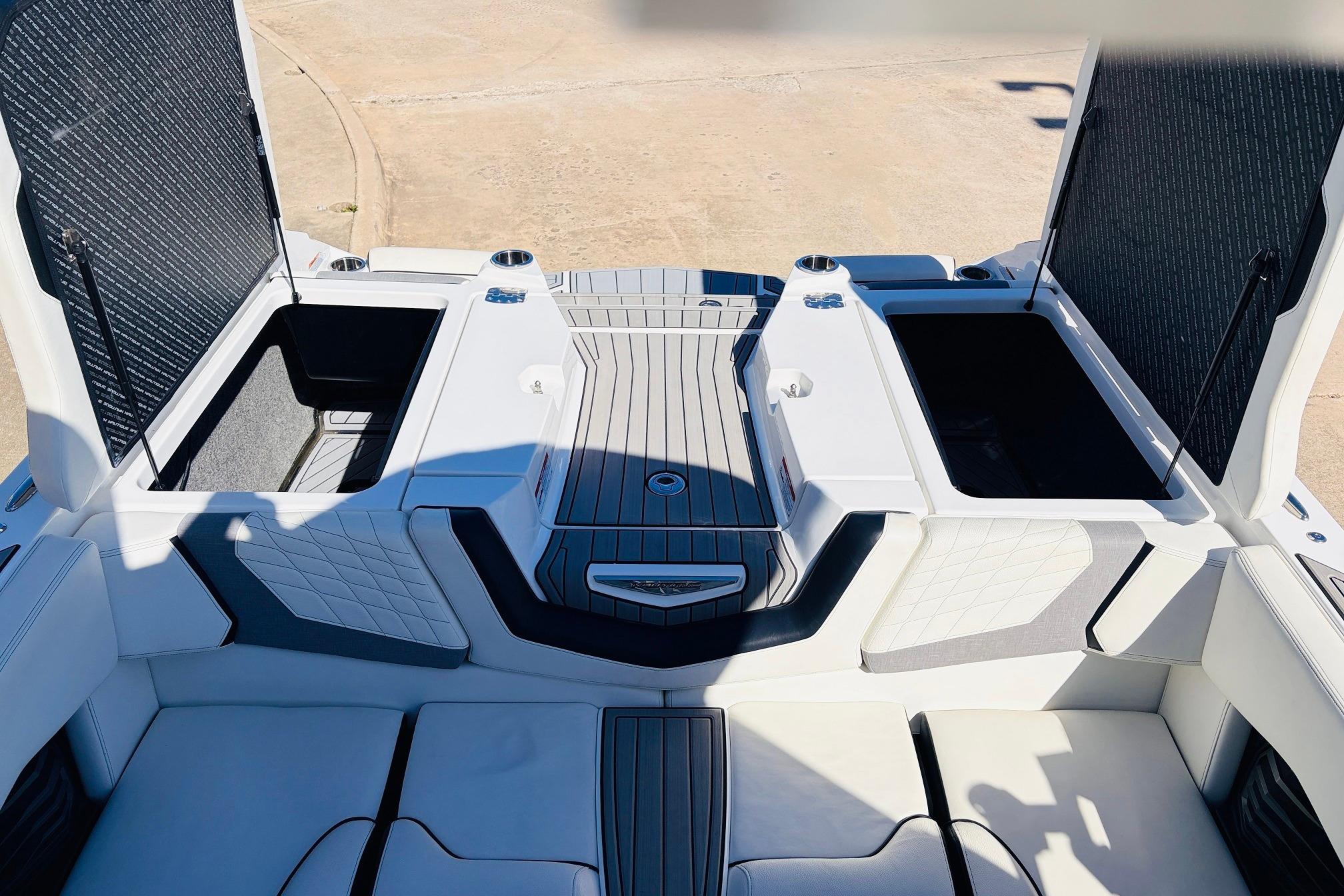 2023 Nautique Super Air Nautique G25 boat interior with open storage compartments.