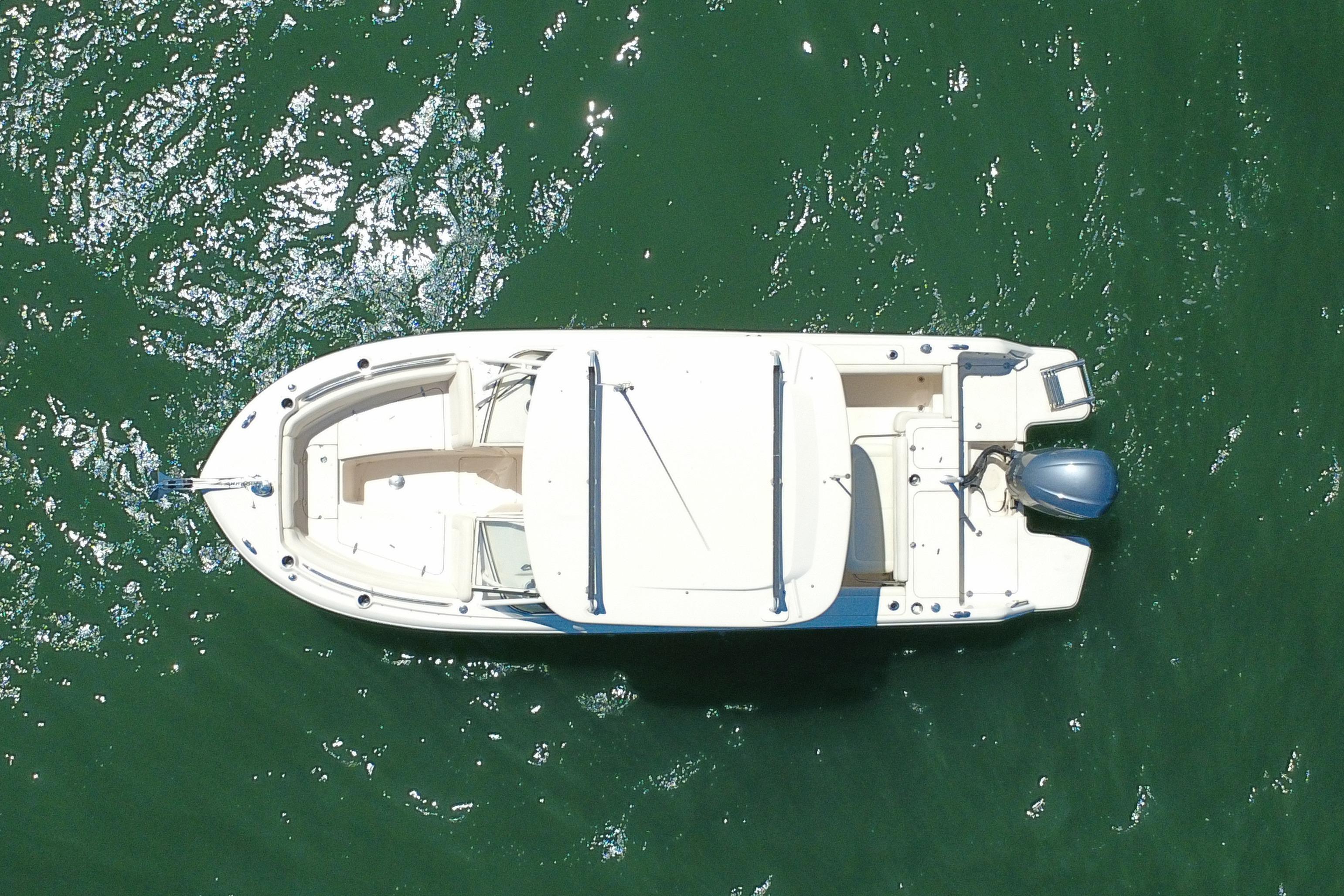 Overhead view of 2017 Grady-White Freedom 235 boat on green water.
