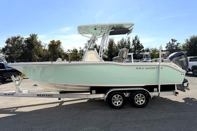 2025 Key West 239 FS boat on trailer, side view, outdoors.
