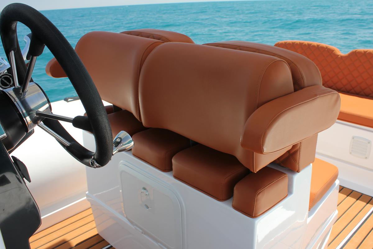 Luxurious seating on 2025 Tiger Marine 740 PL boat with ocean backdrop.