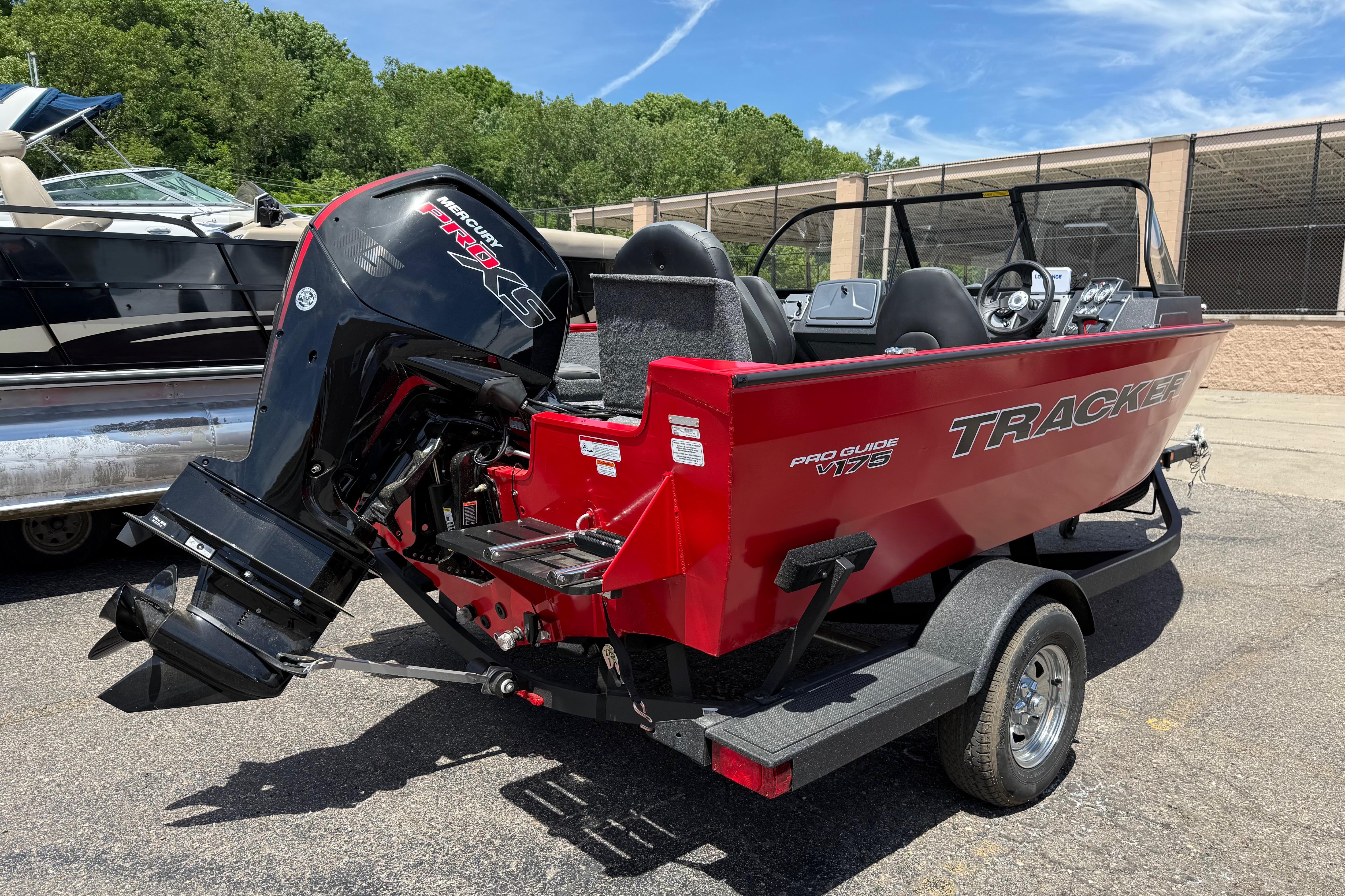 2026 Tracker Pro Guide V-175 Combo boat with Mercury Pro XS engine, parked outdoors.