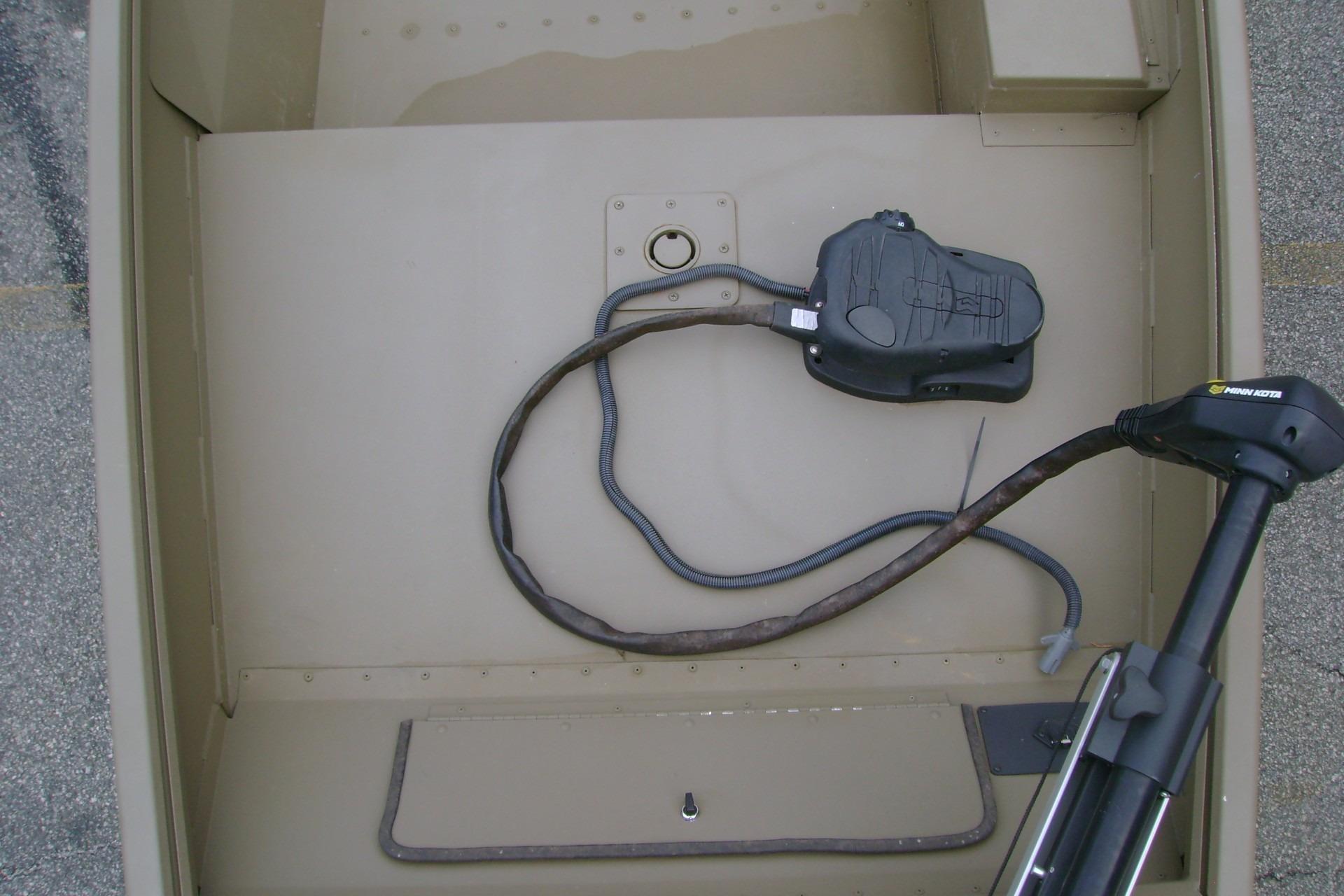 2023 G3 1652 DK boat interior with trolling motor and wiring.