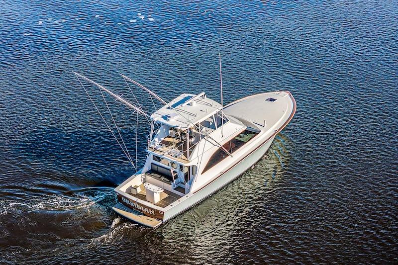 Aerial view of 1991 Ocean Yachts 53 Super Sport cruising on open water.