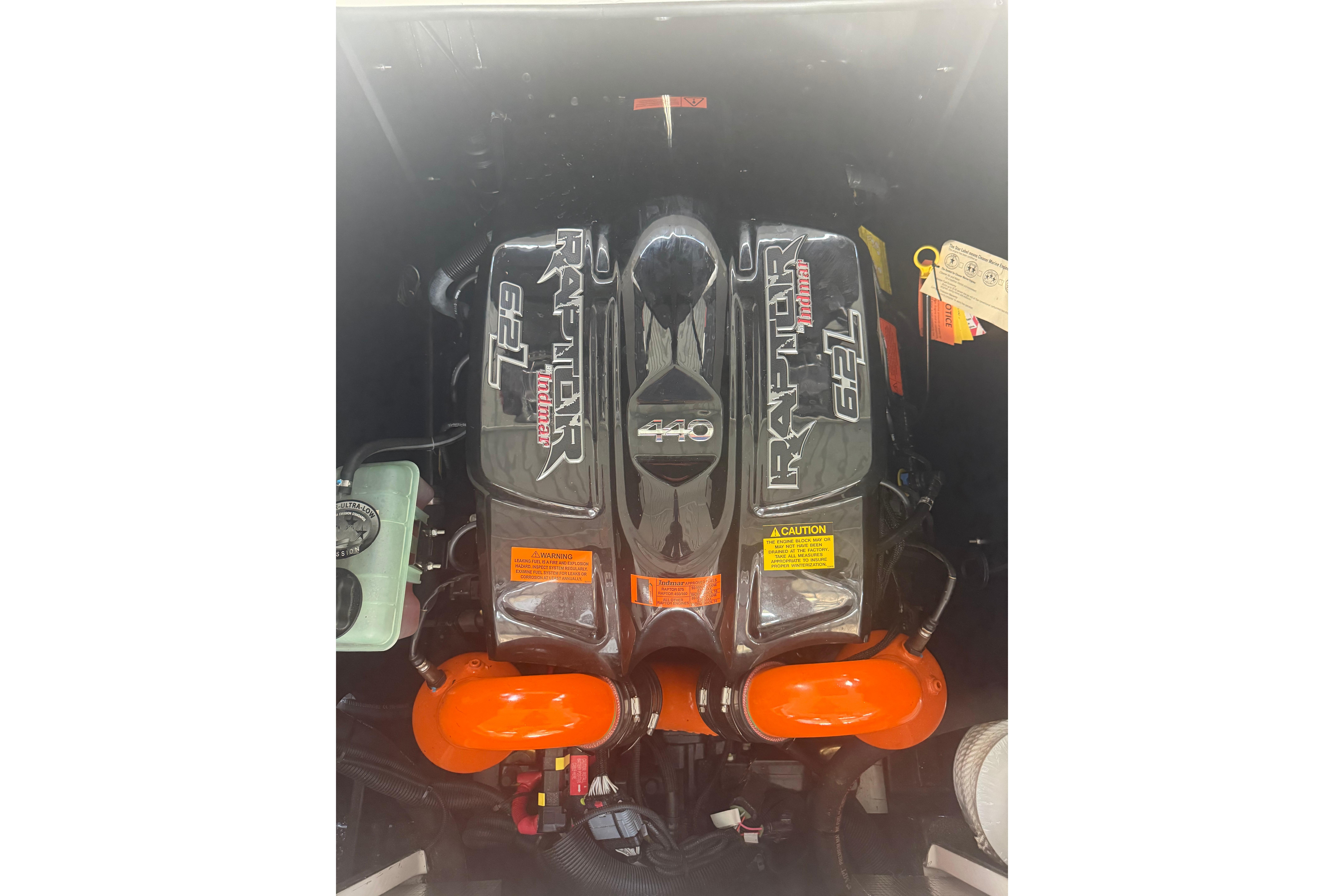 Engine of 2020 Tige 25ZX boat, featuring Raptor 6.2L motor with orange accents.