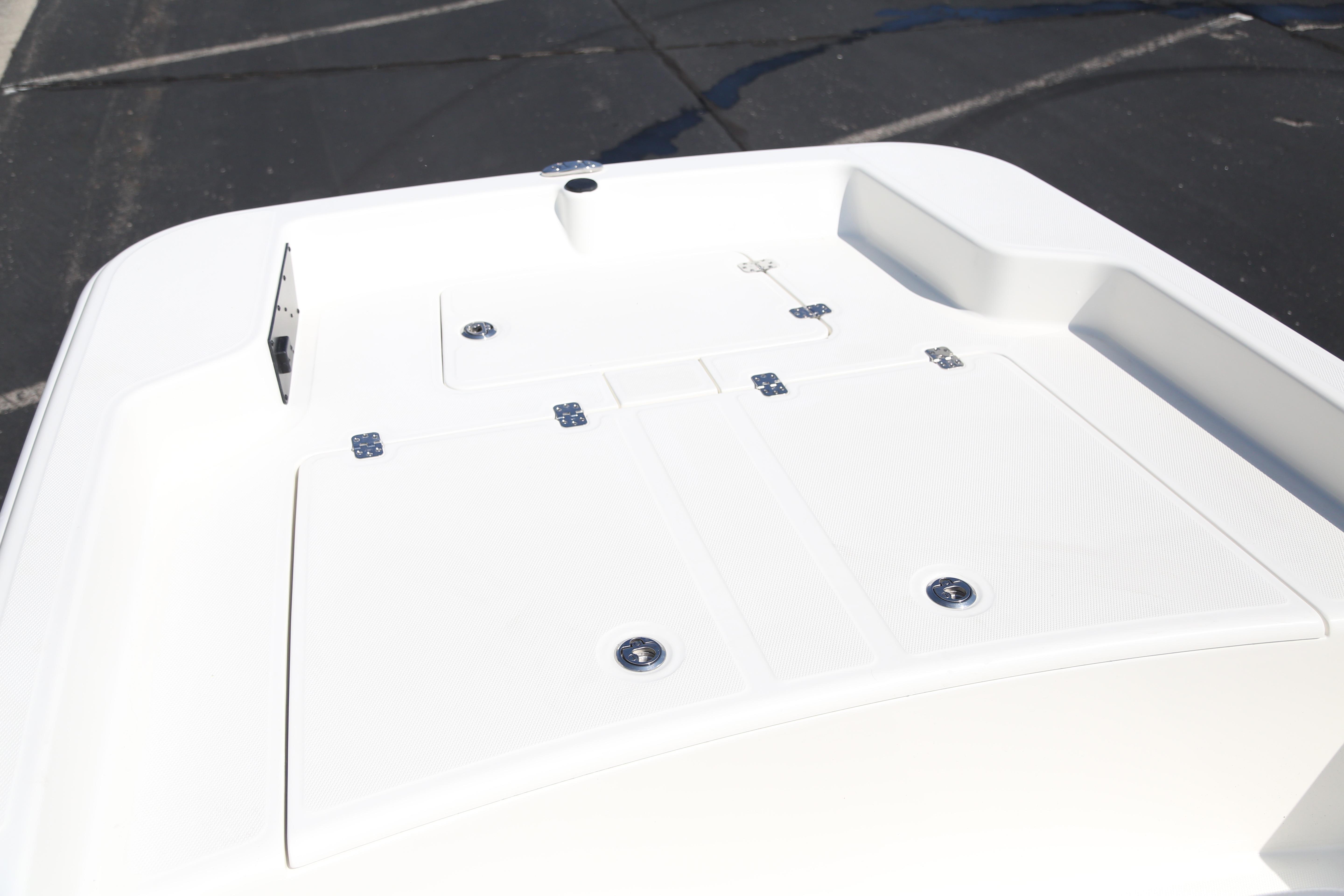 2026 Mako Pro Skiff 15 CC boat deck, featuring storage compartments and sleek design.