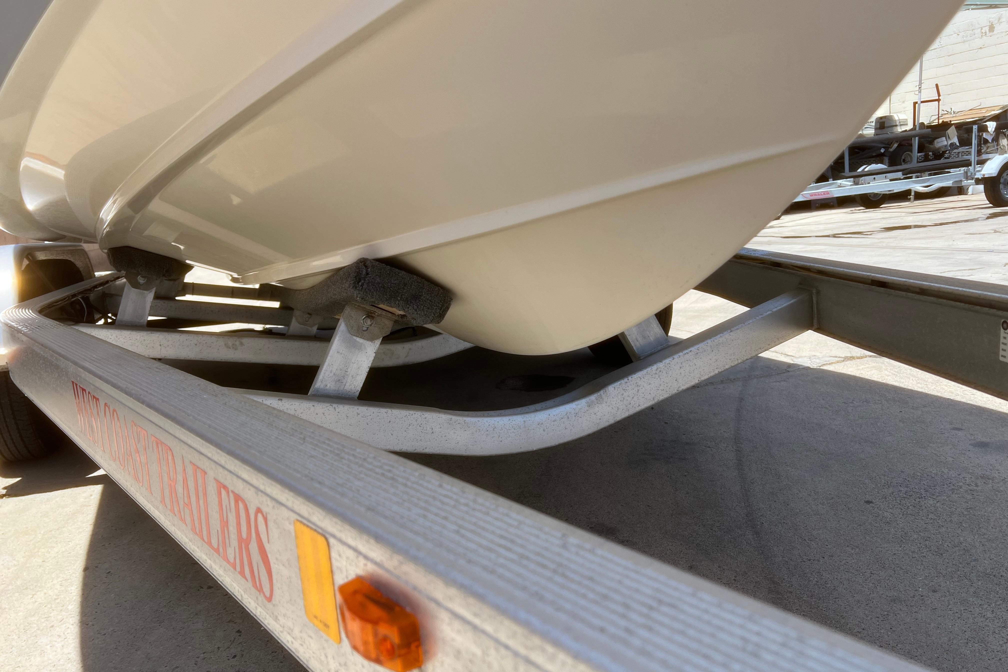 2018 Cobia 201 Center Console boat on trailer, close-up view.