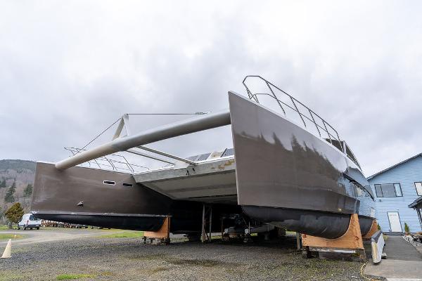 2025 Catamaran Bloomfield 86 Motorsailor on land, showcasing sleek design and dual hulls.