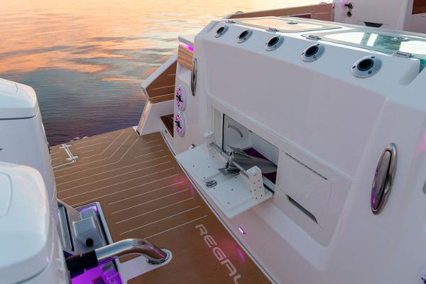 Manufacturer Provided Image: Sleek 2026 Regal LX43 boat deck at sunset, featuring modern design and advanced amenities.