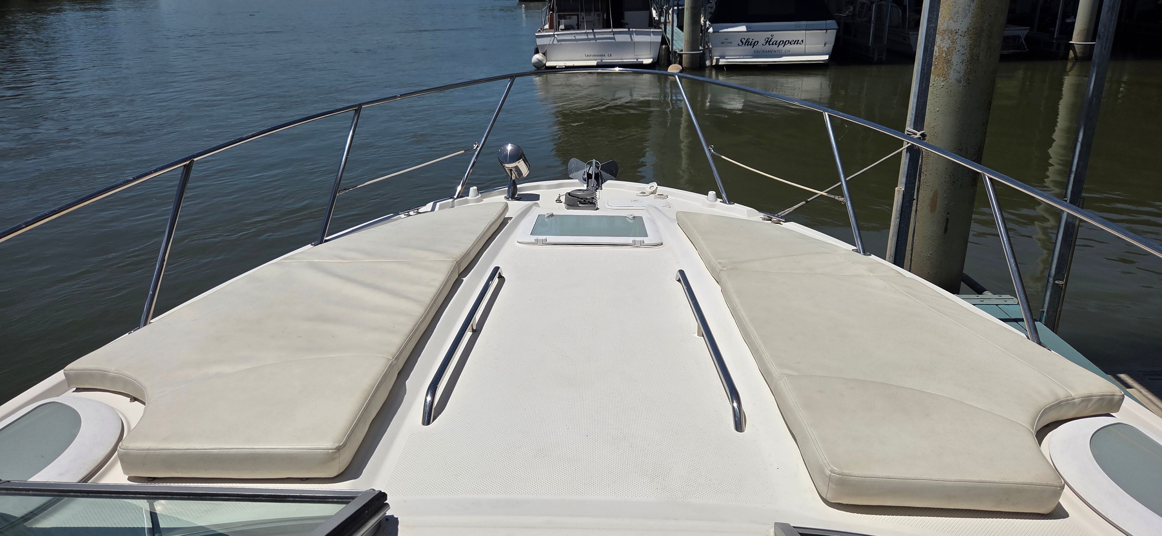 2012 Bayliner 335 Cruiser with sun deck on calm water.
