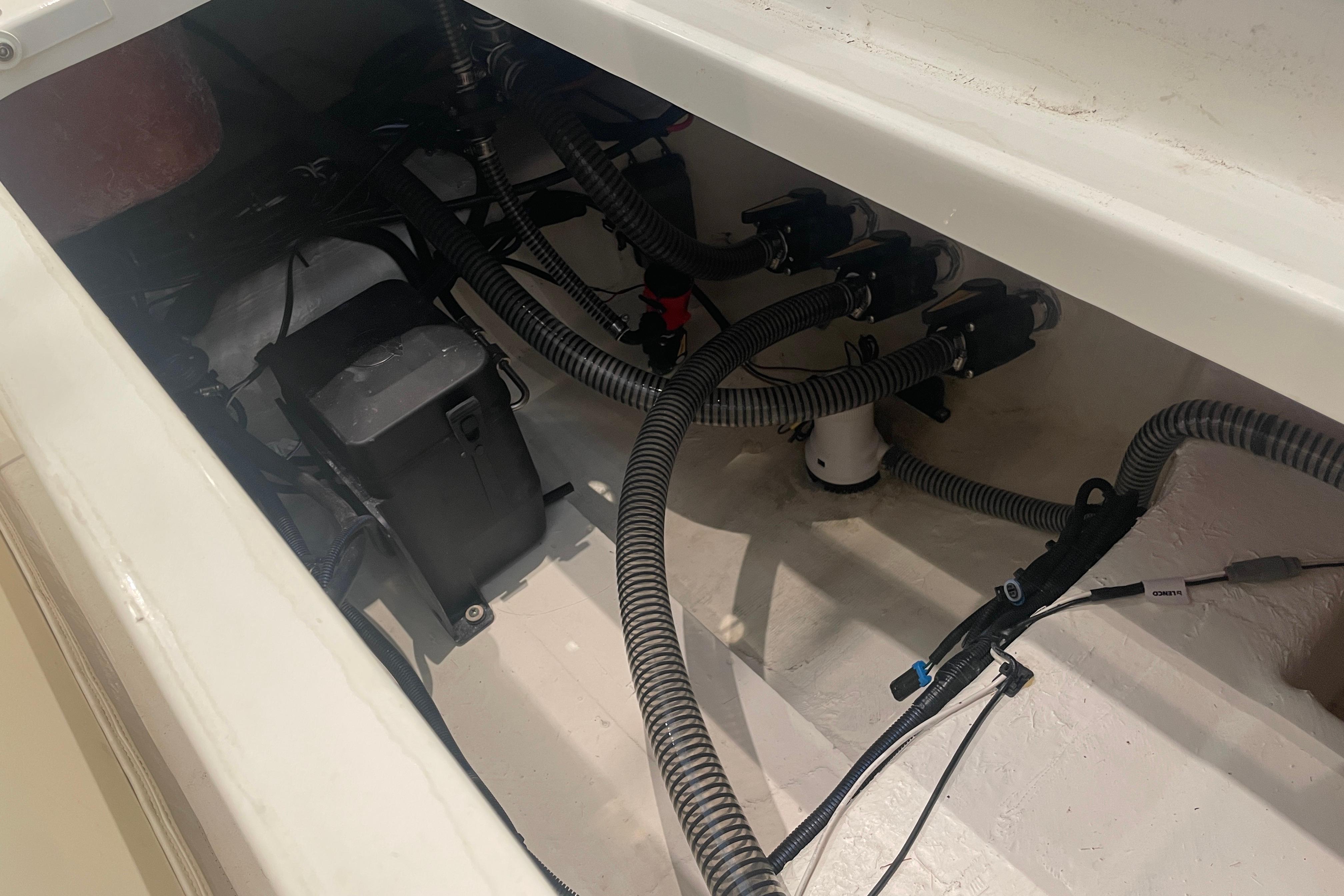 2026 Mako 226 Center Console boat wiring and battery compartment.