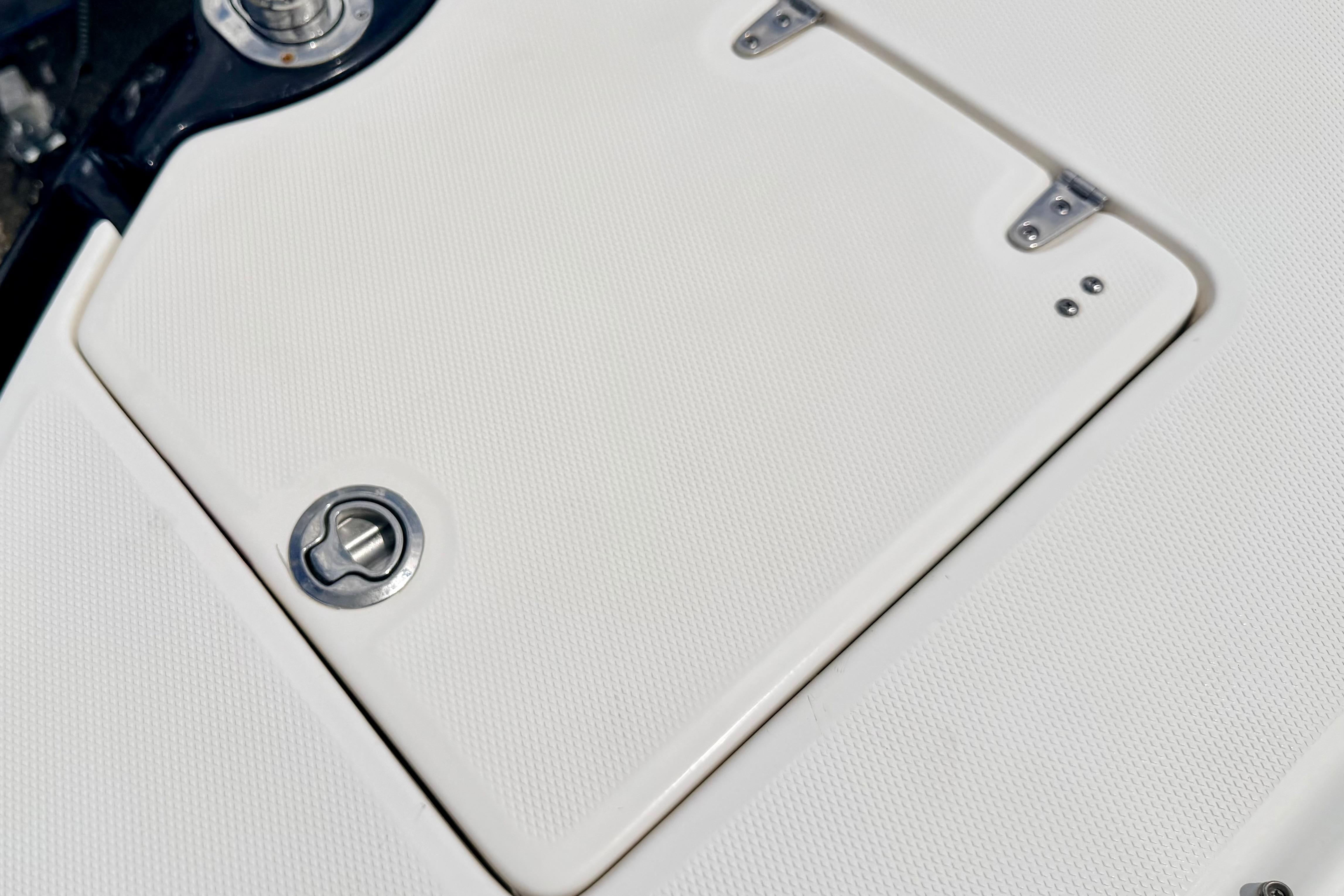 2015 Chaparral Sunesta 264 boat deck with textured surface and metal fittings.