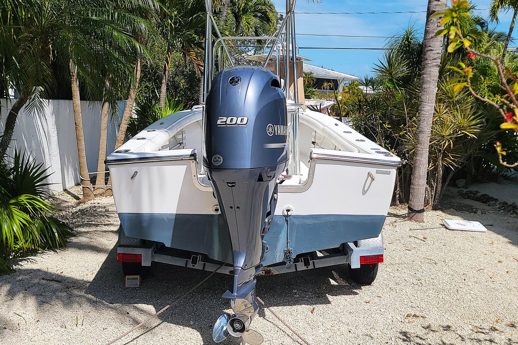 2008 SeaCraft SC 20 Classic boat with Yamaha 200 engine, parked outdoors.