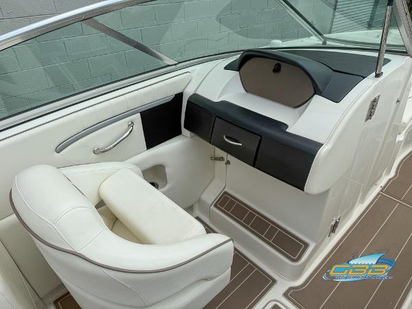 2008 Sea Ray 270 SLX boat interior with white seating and dashboard.