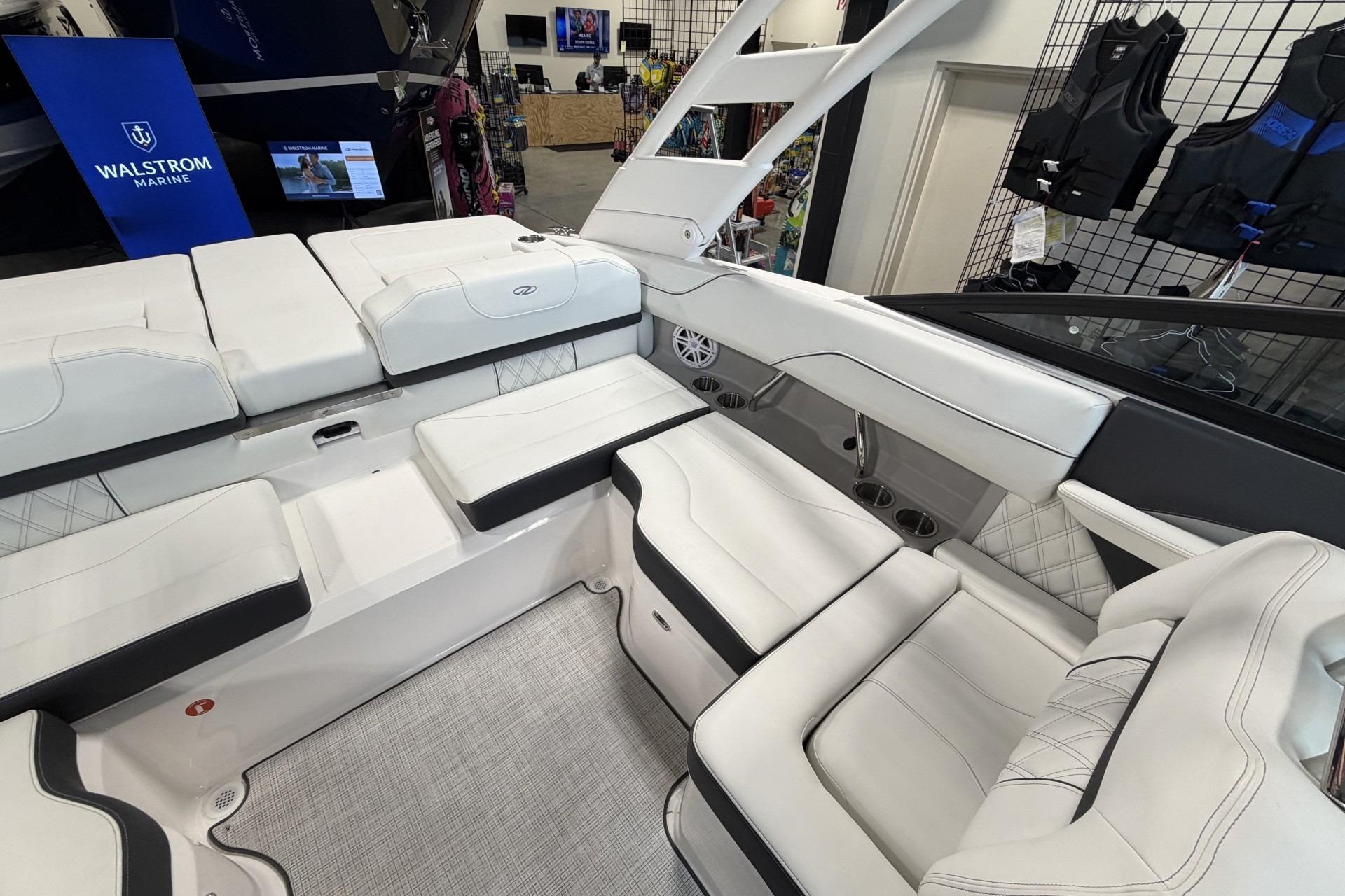 Luxurious interior of 2027 Regal LS2 boat with white seating and modern design.