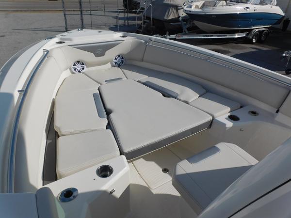 2025 Sailfish 232 CC boat interior with cushioned seating and cup holders.
