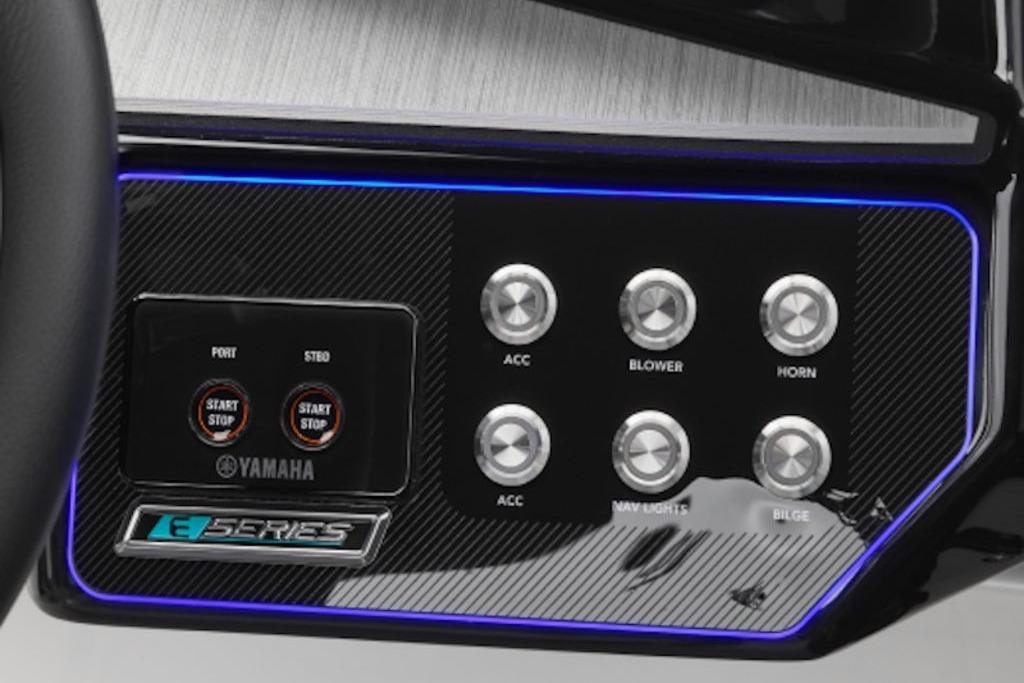 Control panel of 2026 Yamaha Boats 222XE with illuminated buttons and sleek design.