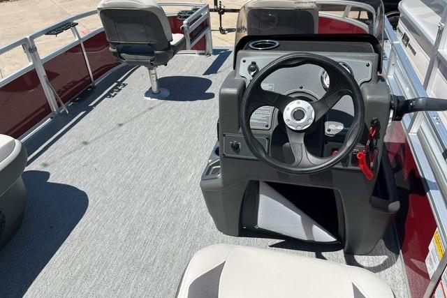 2026 Sun Tracker Bass Buggy 16 XL Select pontoon boat interior with steering console.