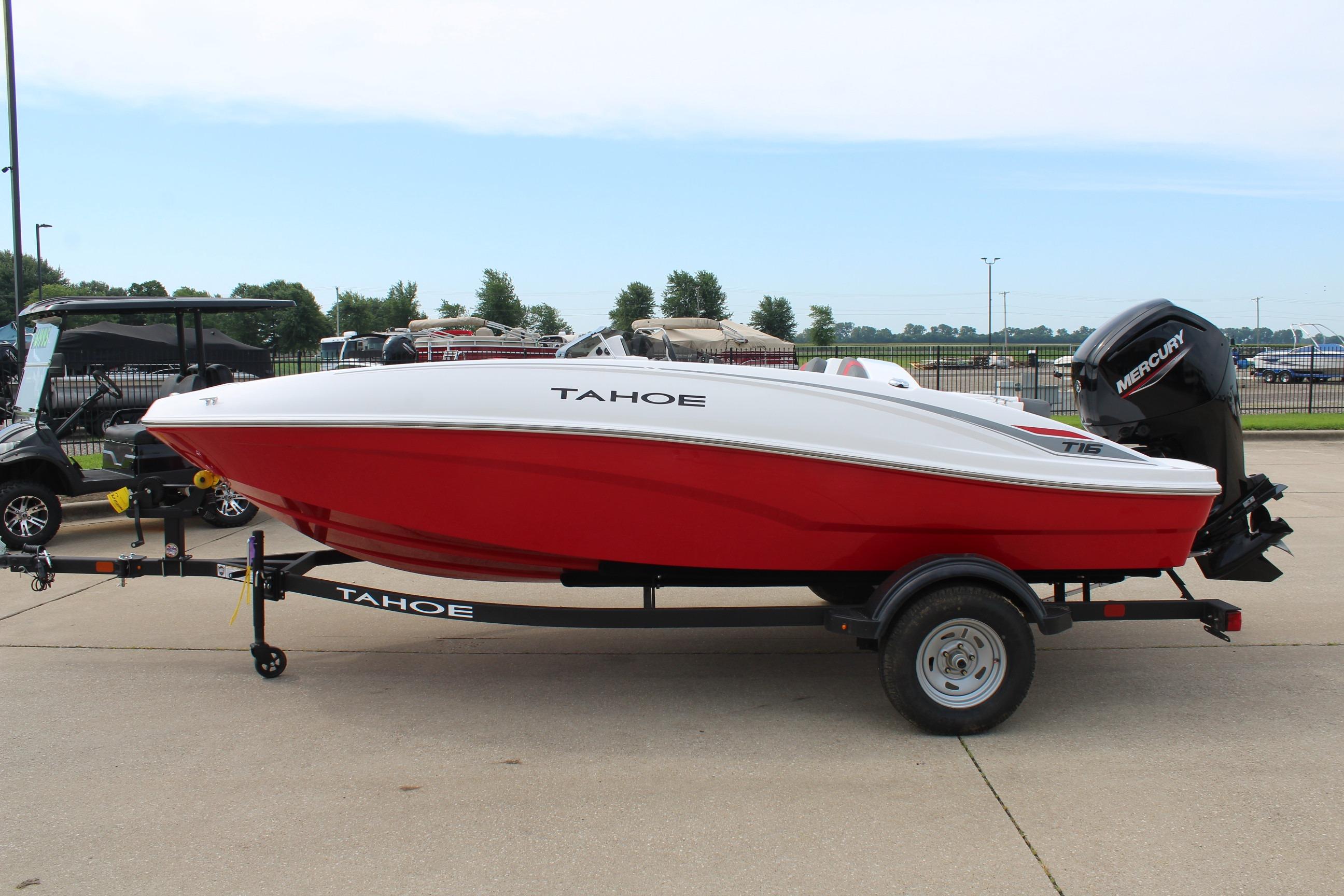 2026 Tahoe T16 boat with red hull on trailer, parked outdoors.